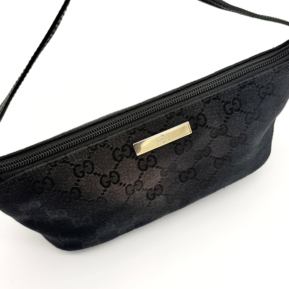 Gucci GG Monogram Pochette Boat Shoulder Bag in black GG jacquard with gold-tone hardware and black leather trim displayed with dust bag.