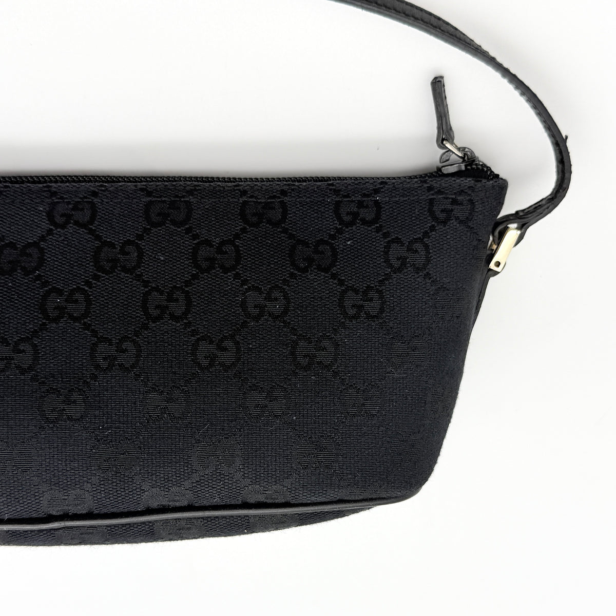 Gucci GG Monogram Pochette Boat Shoulder Bag in black GG jacquard with gold-tone hardware and black leather trim displayed with dust bag.