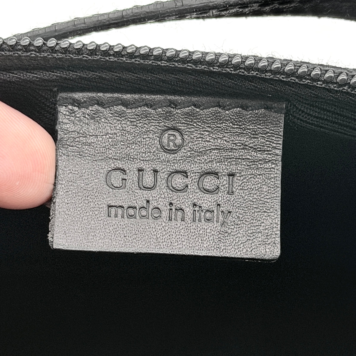 Gucci GG Monogram Pochette Boat Shoulder Bag in black GG jacquard with gold-tone hardware and black leather trim displayed with dust bag.