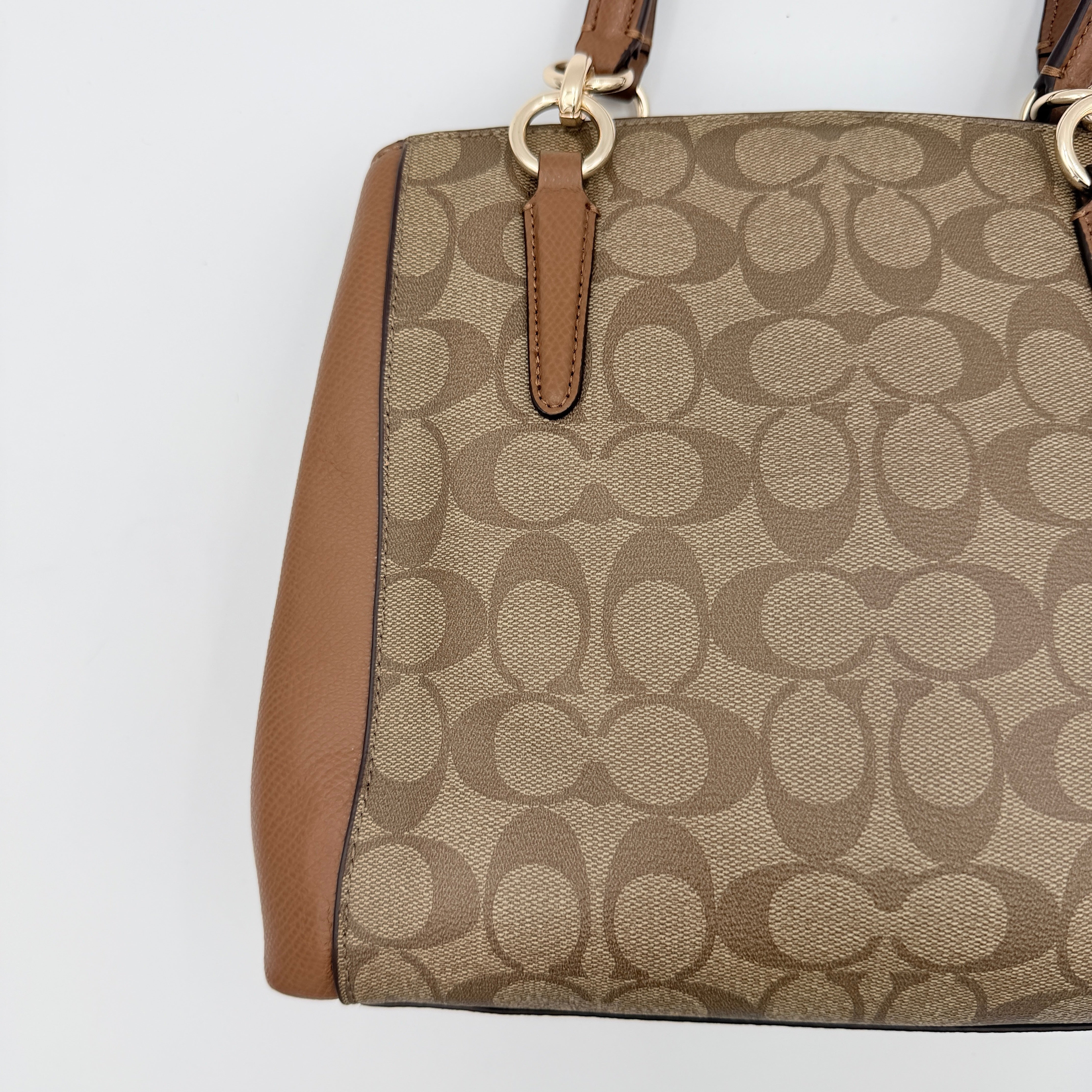 Coach Mini Christie Carryall in brown canvas and leather, shown with top handles and detachable strap.
