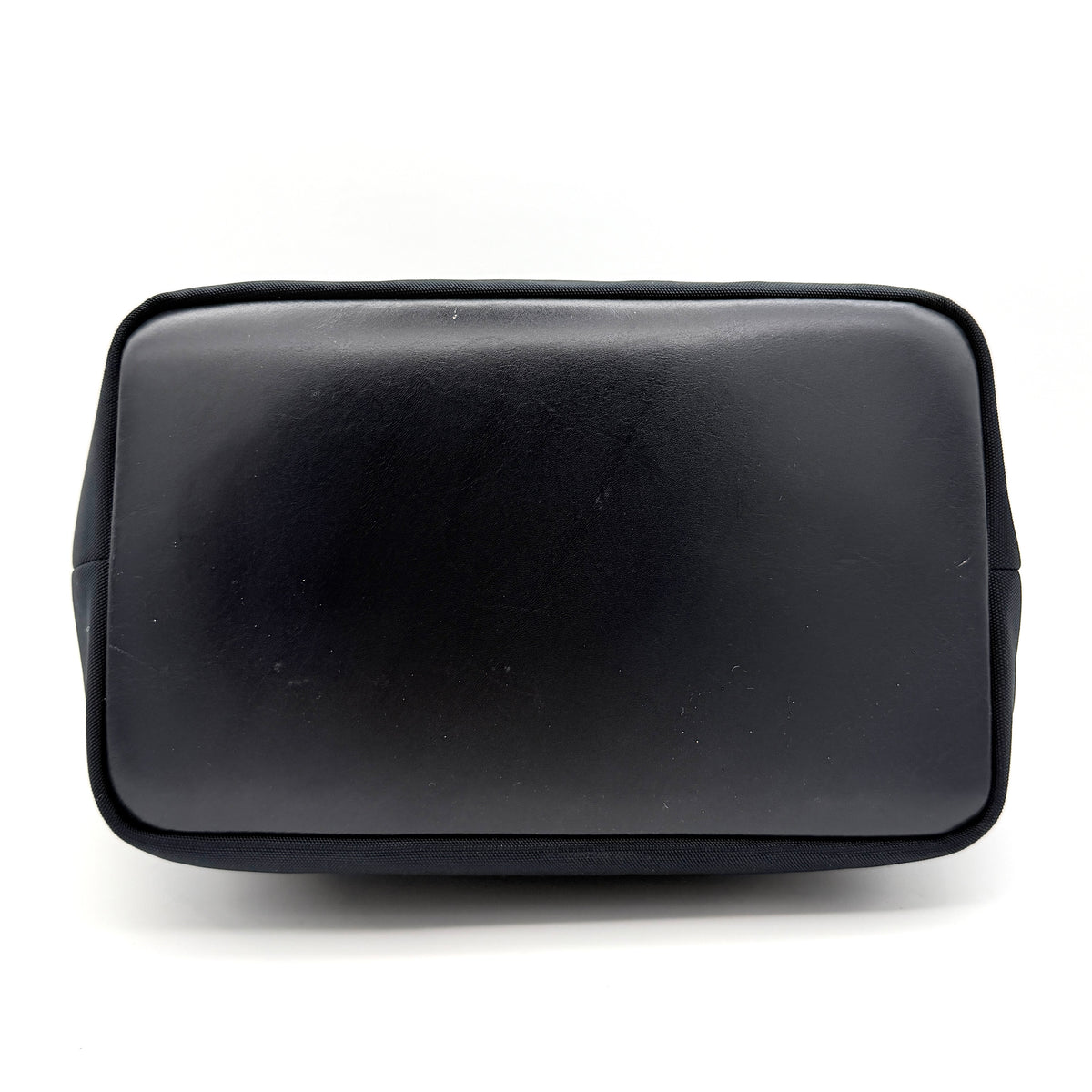 Gucci black nylon shoulder bag with bamboo handle and silver-tone hardware against a white background.