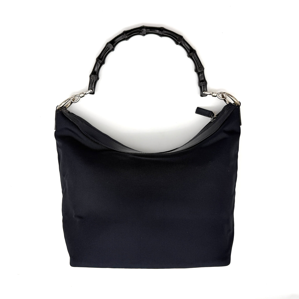 Gucci black nylon shoulder bag with bamboo handle and silver-tone hardware against a white background.