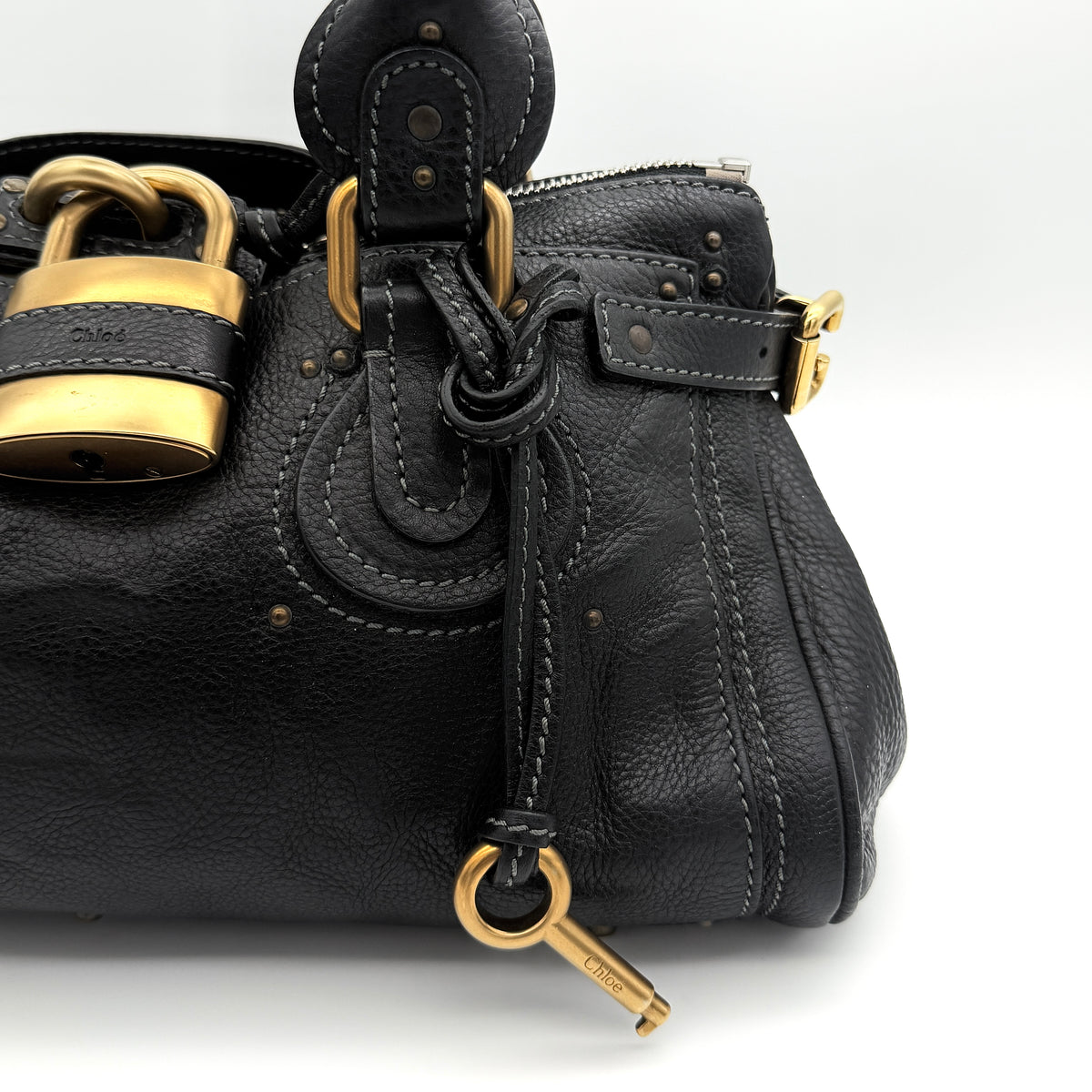 Front view of the Chloe Paddington Shoulder Bag in black leather with gold-tone hardware and signature padlock.