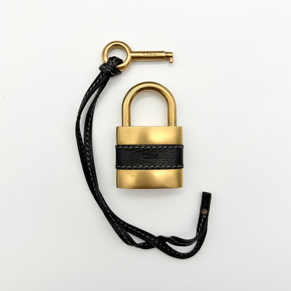 Front view of the Chloe Paddington Shoulder Bag in black leather with gold-tone hardware and signature padlock.