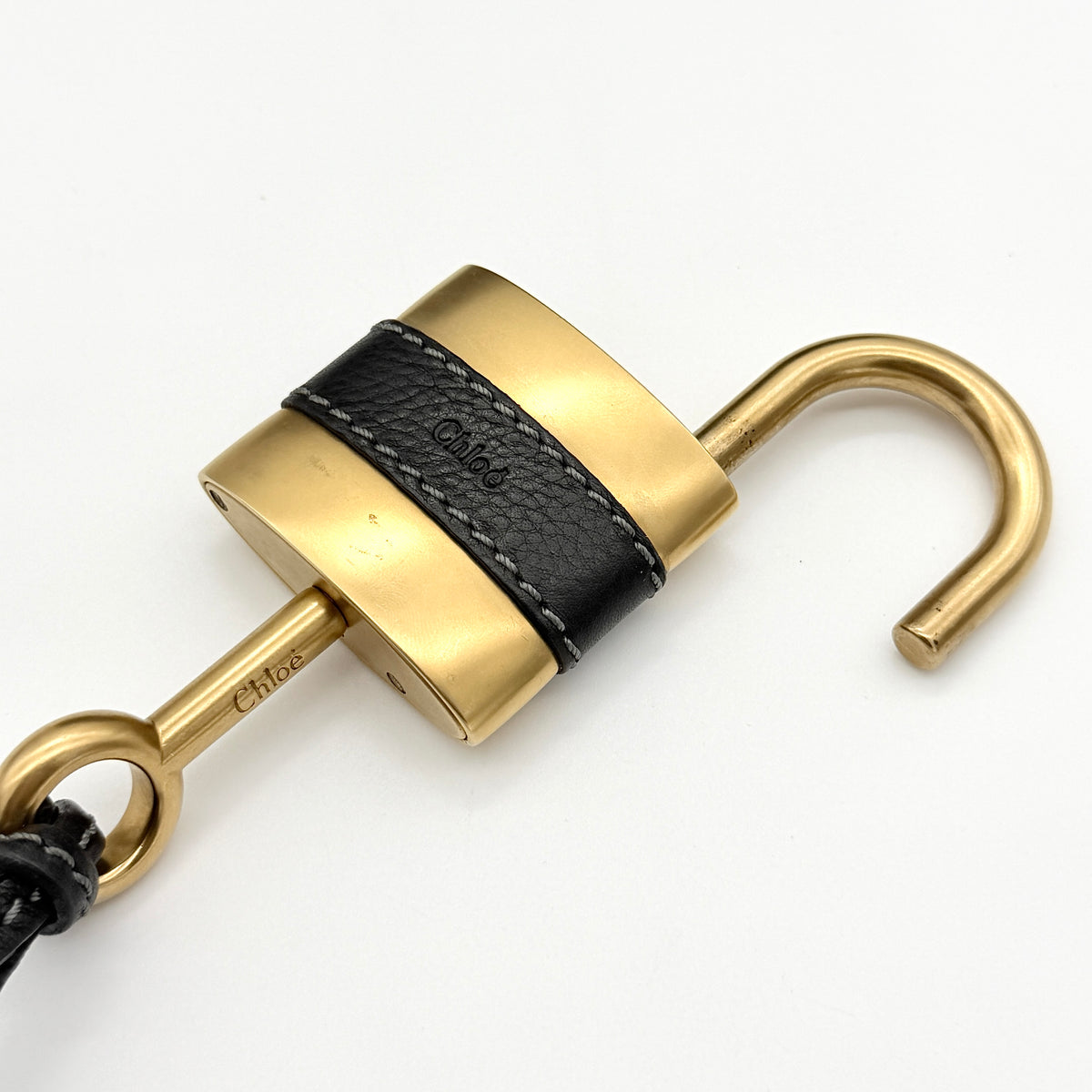 Front view of the Chloe Paddington Shoulder Bag in black leather with gold-tone hardware and signature padlock.