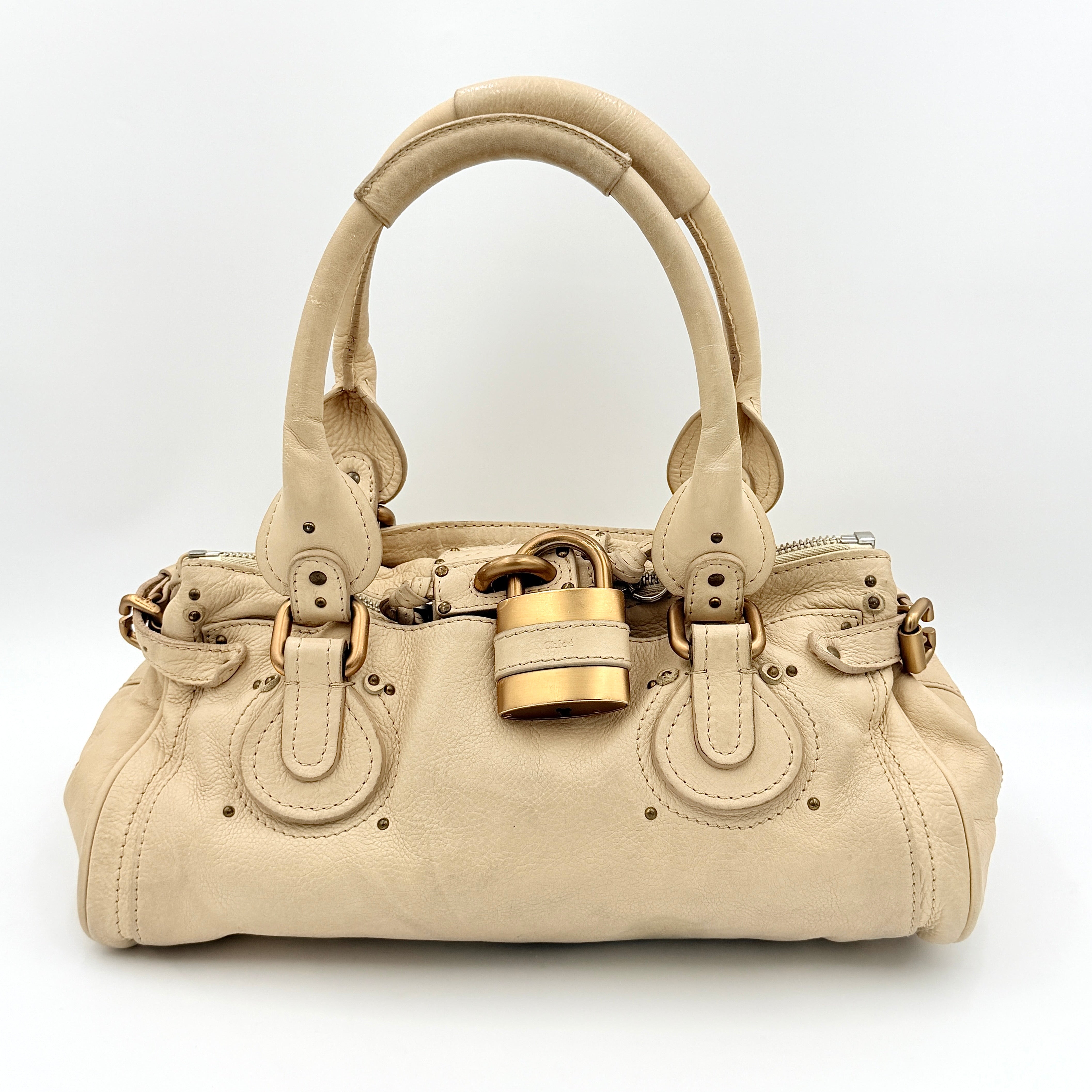 Chloé Paddington Shoulder Bag in ivory leather with signature brass padlock and double rolled handles.