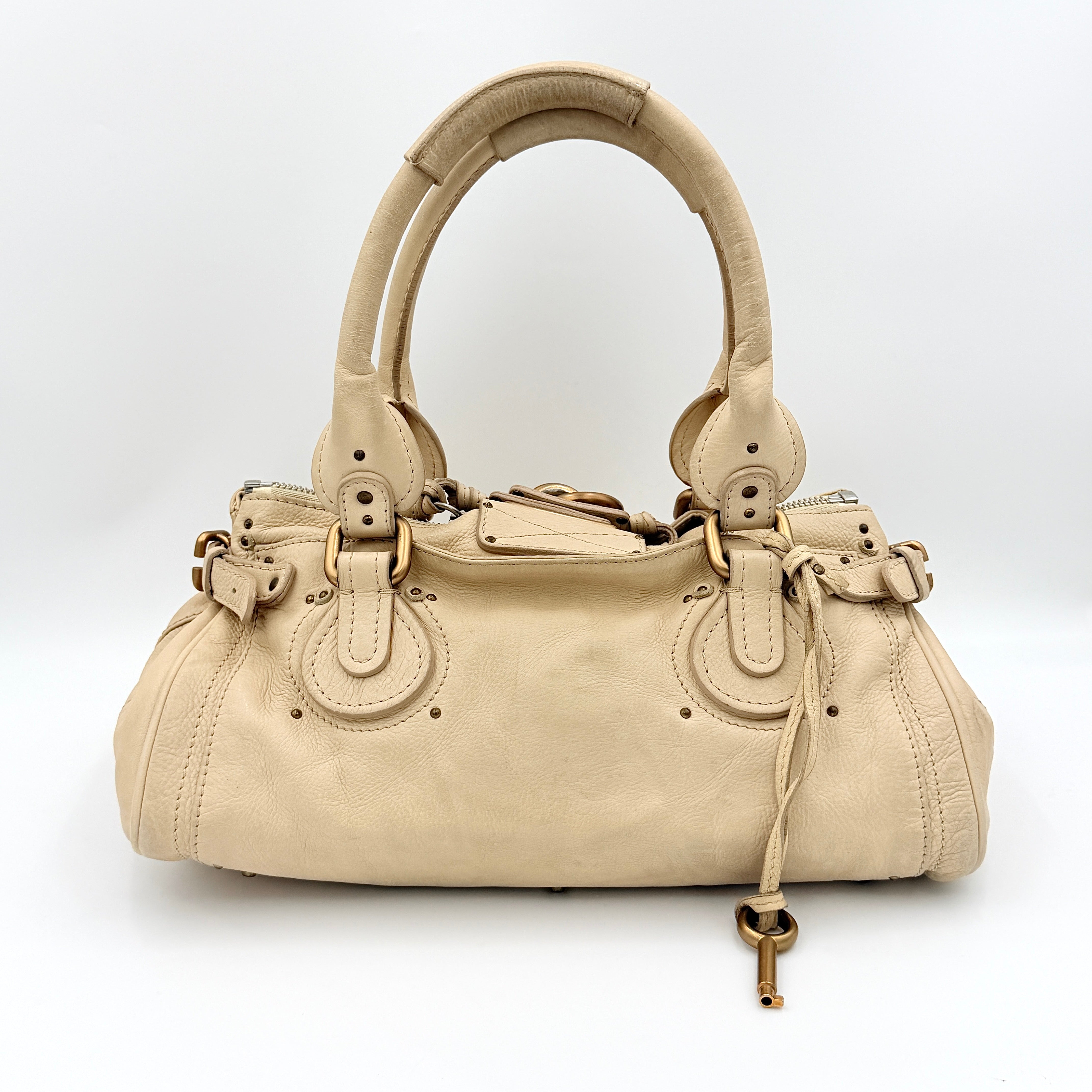 Chloé Paddington Shoulder Bag in ivory leather with signature brass padlock and double rolled handles.