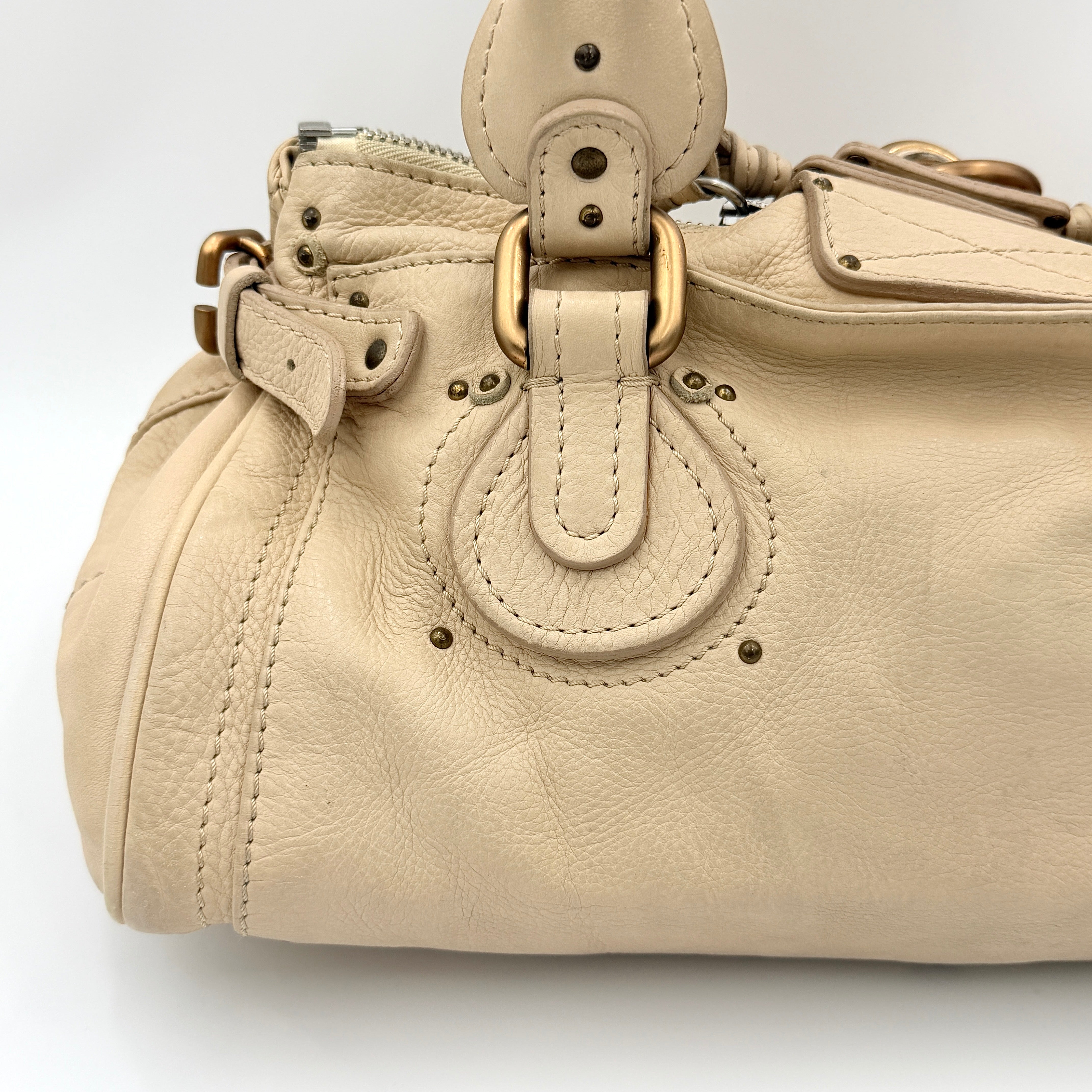 Chloé Paddington Shoulder Bag in ivory leather with signature brass padlock and double rolled handles.