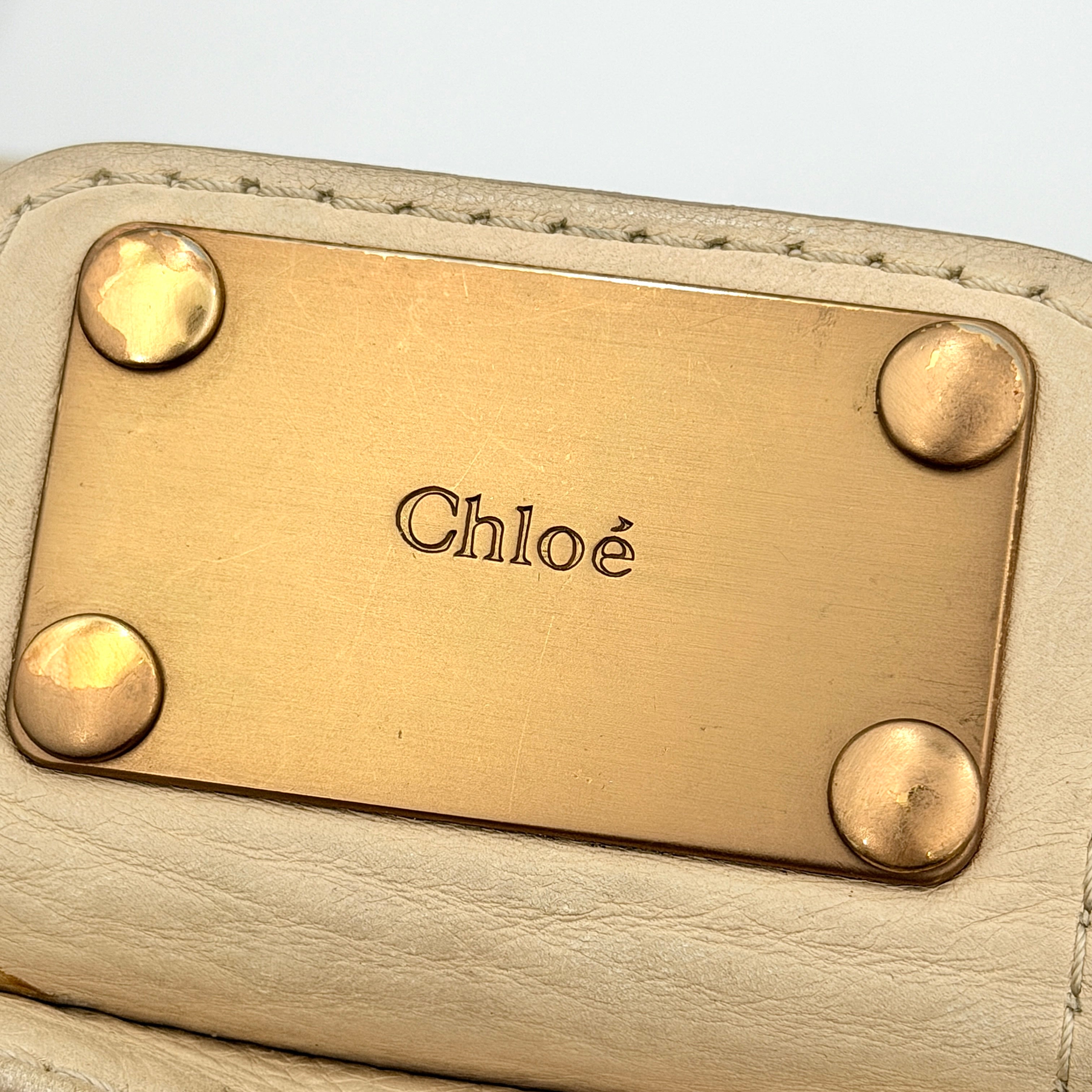 Chloé Paddington Shoulder Bag in ivory leather with signature brass padlock and double rolled handles.