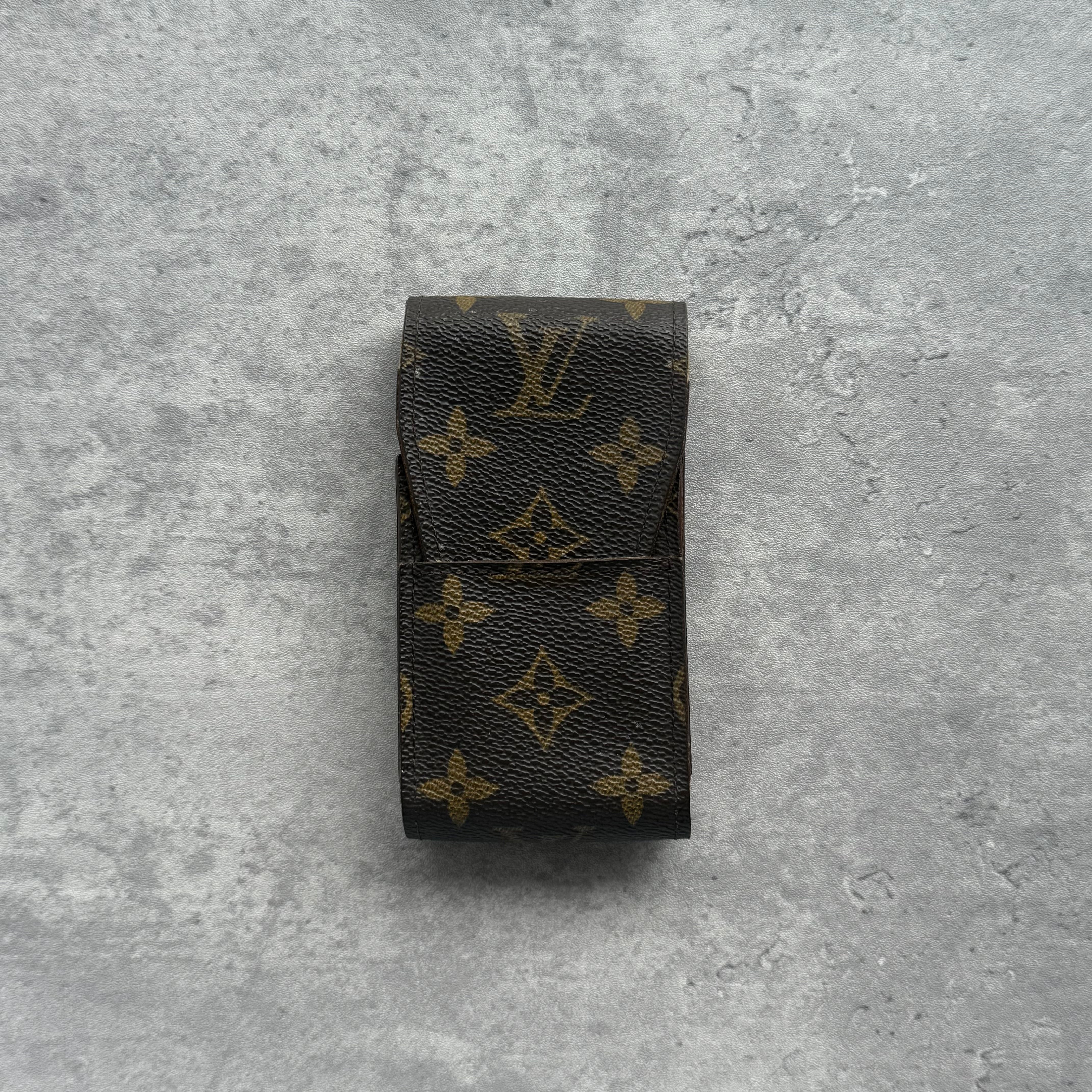 Louis Vuitton Monogram Cigarette Case in brown coated canvas with classic LV monogram pattern and flap closure.