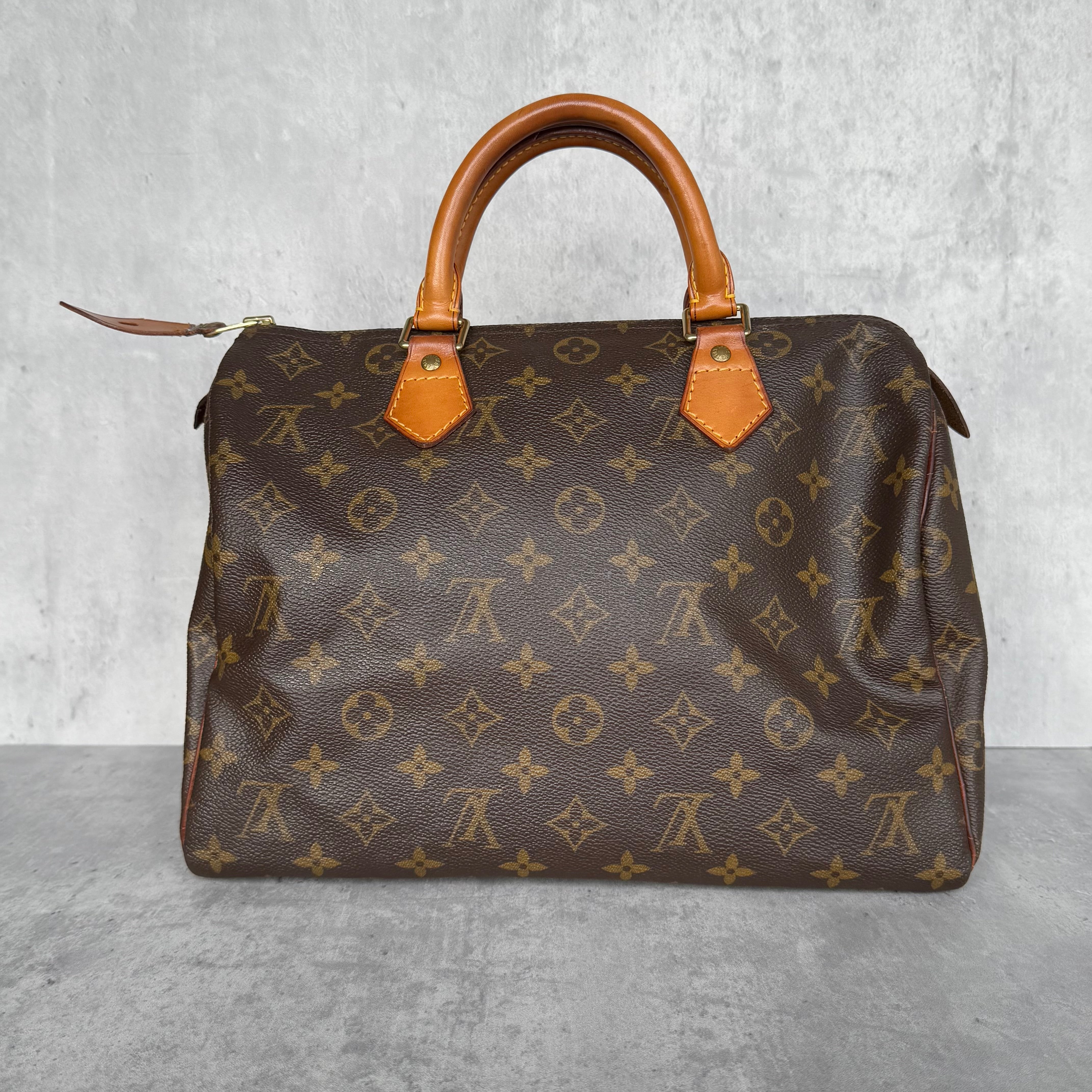 Louis Vuitton Monogram Speedy 30 Handbag Brown, featuring coated canvas with cowhide leather handles and gold-tone hardware.