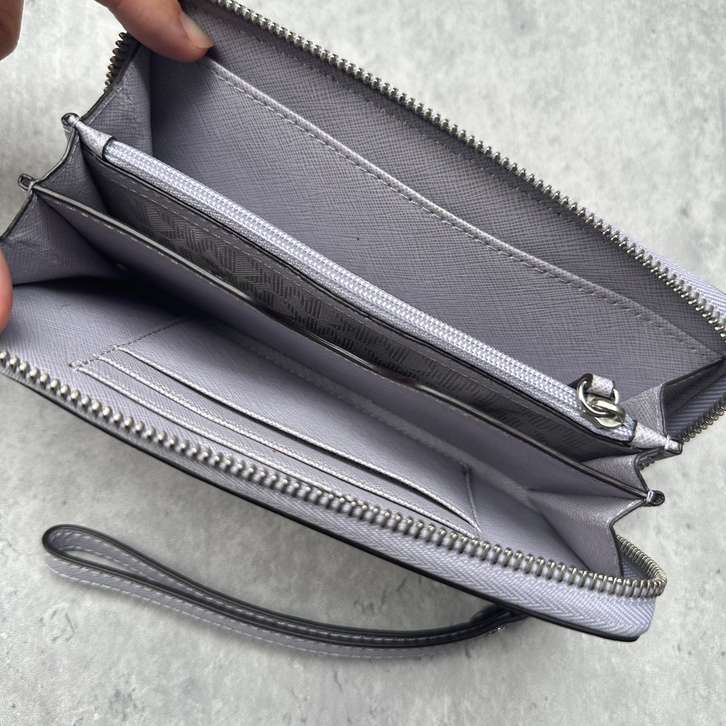 Michael Kors Jet Set Travel Wristlet Wallet in saffiano leather with zip closure and detachable strap