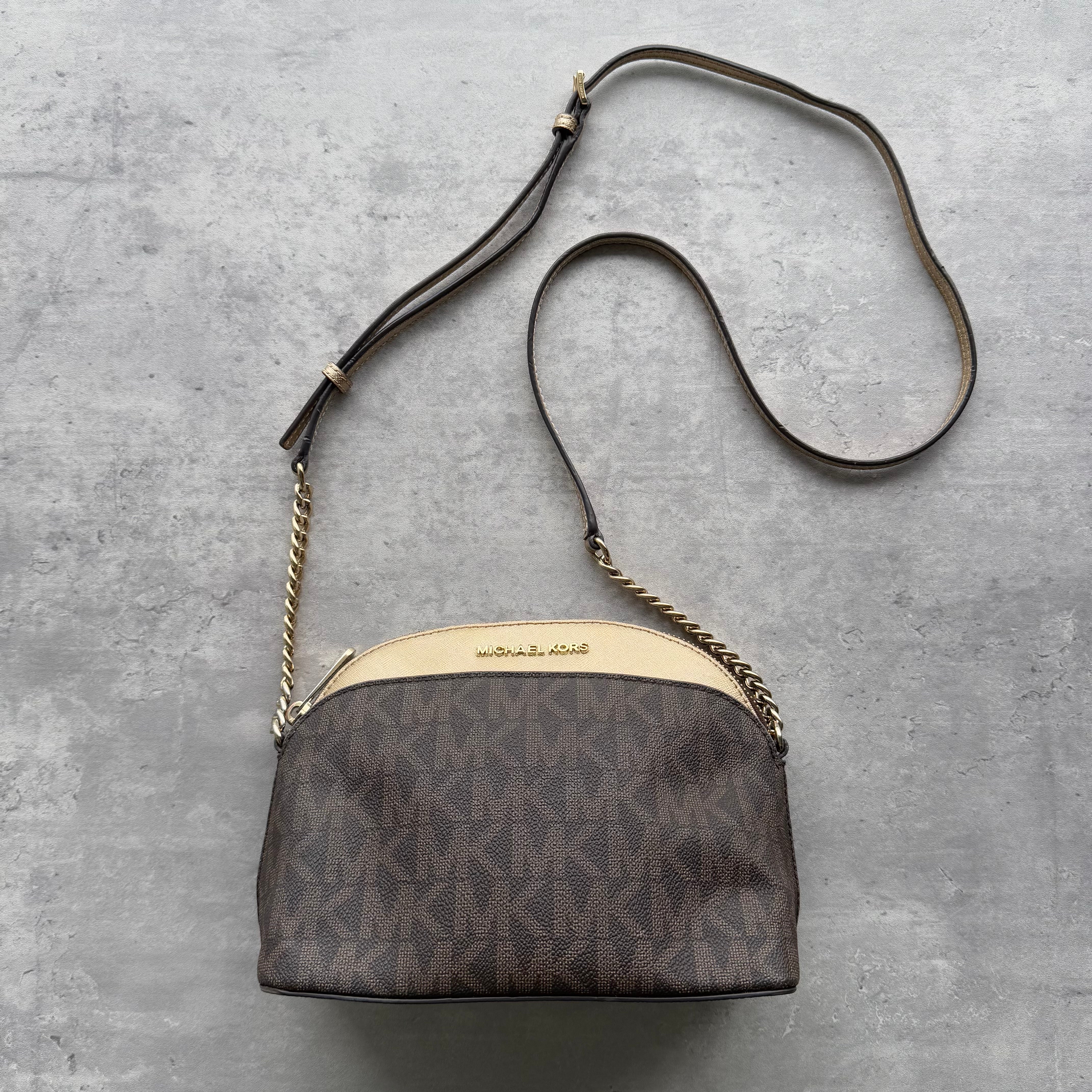 Michael Kors Monogram Crossbody Bag in brown MK canvas with cream trim, gold-tone hardware, and chain-accented adjustable strap.v
