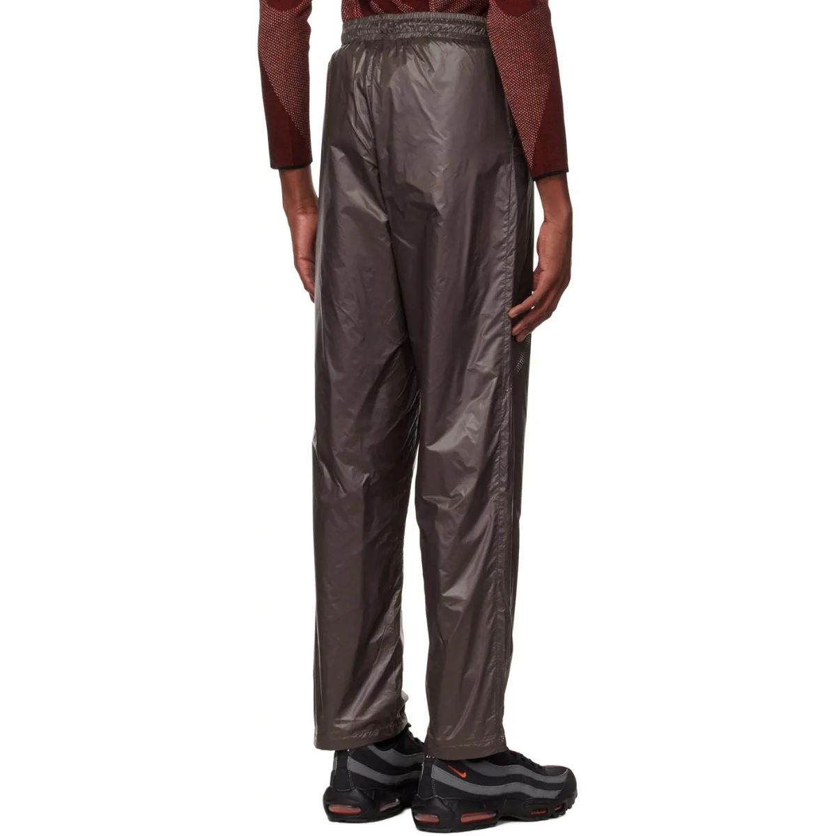 Saul Nash Perforated Trousers Brown made from lightweight nylon with subtle sheen, relaxed fit, and elastic waistband