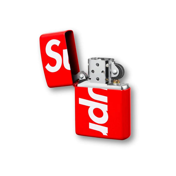 Supreme Logo Zippo Red, featuring a high-gloss metal casing, iconic white Supreme branding, and a classic windproof flip-top design.