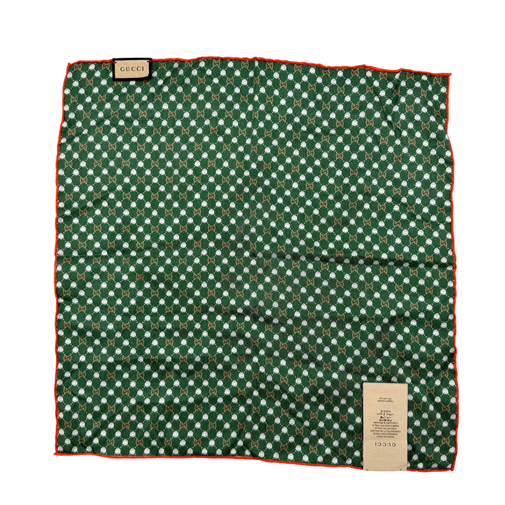 Gucci GG Monogram Silk Scarf in green silk, featuring a playful allover GG pattern and orange rolled edge.