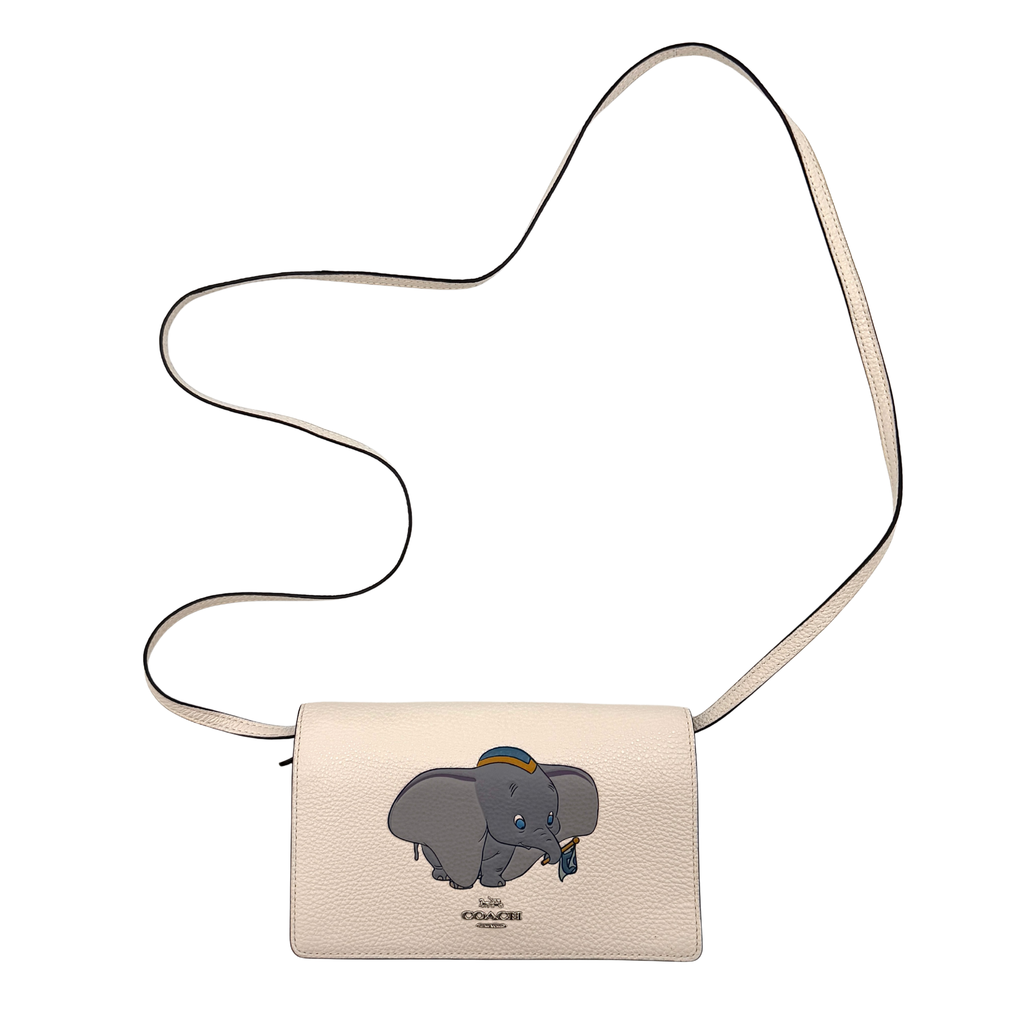 Coach x Disney Dumbo cream foldover crossbody bag with Dumbo illustration and slender strap, displayed against white background.
