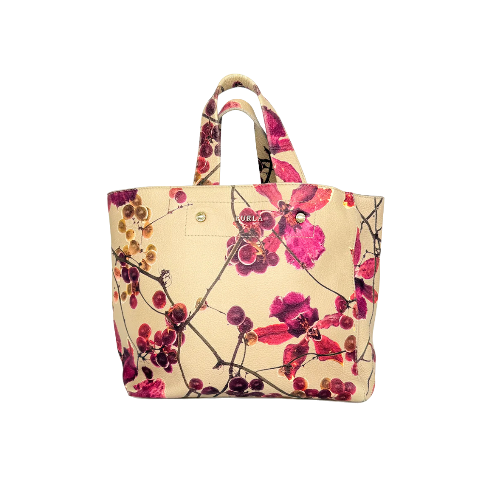 Furla beige leather tote bag adorned with a bold magenta and plum floral print, featuring structured short handles.