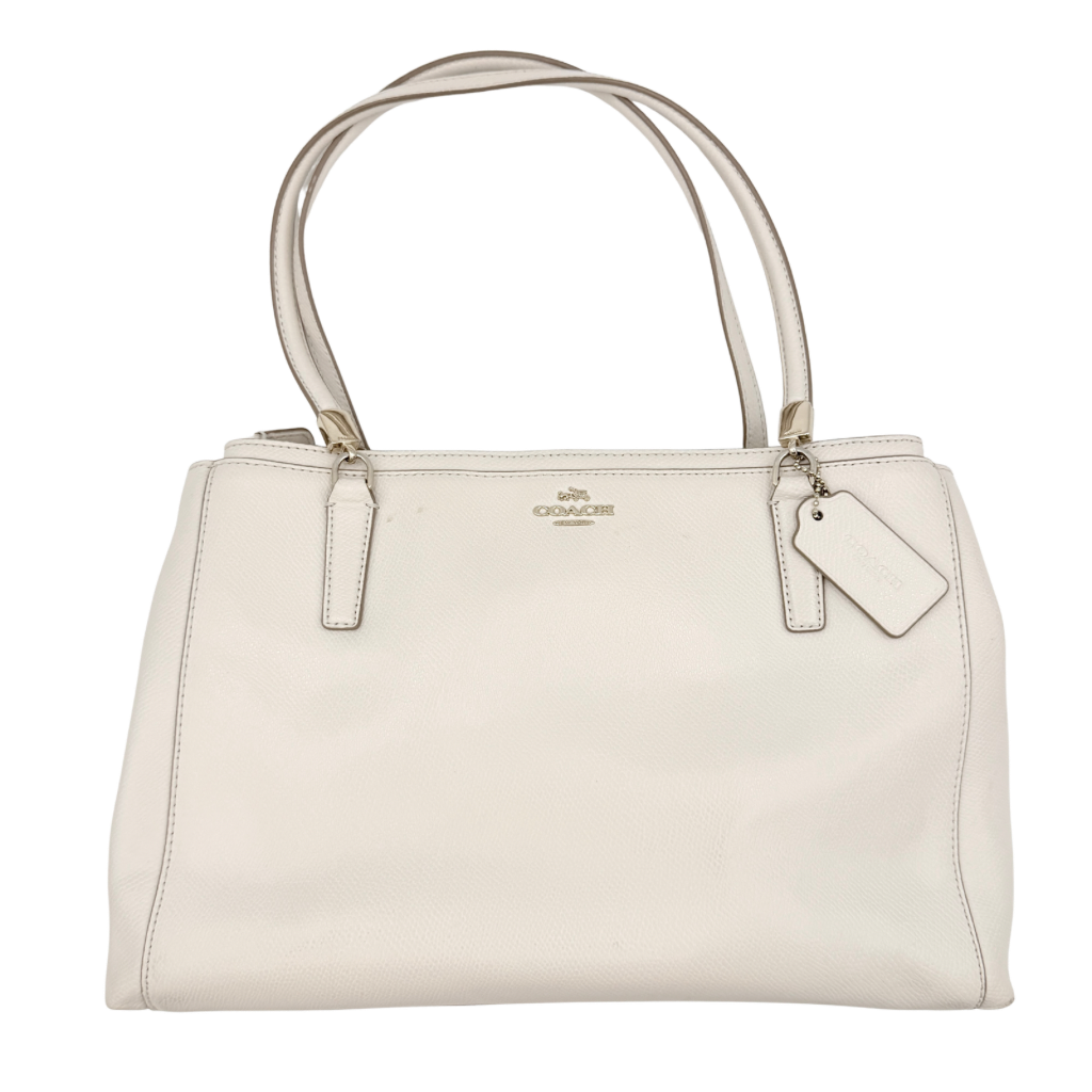 Coach Parker 16 shoulder bag in white leather with dual top handles and gold-tone accents, displayed against a clean background.