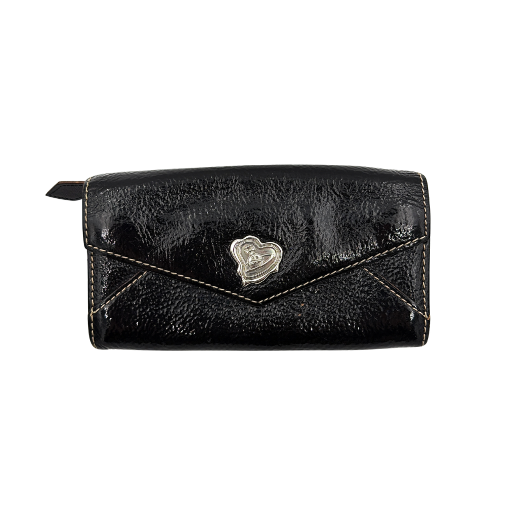 Vivienne Westwood black patent wallet featuring a silver heart orb emblem and envelope flap design.
