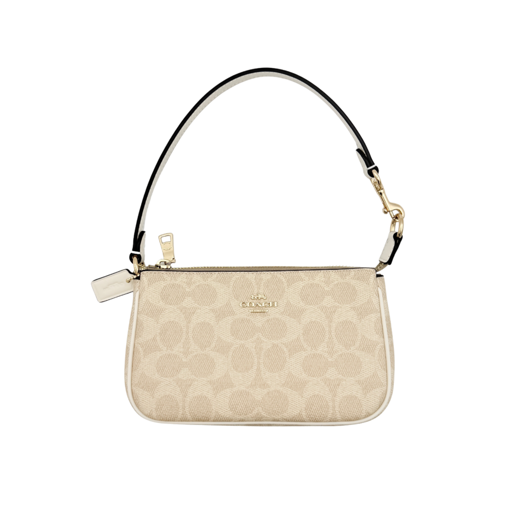 Coach Signature Nolita 19 Shoulder Bag in beige and white canvas with gold-tone hardware and detachable strap, photographed against a plain backdrop.