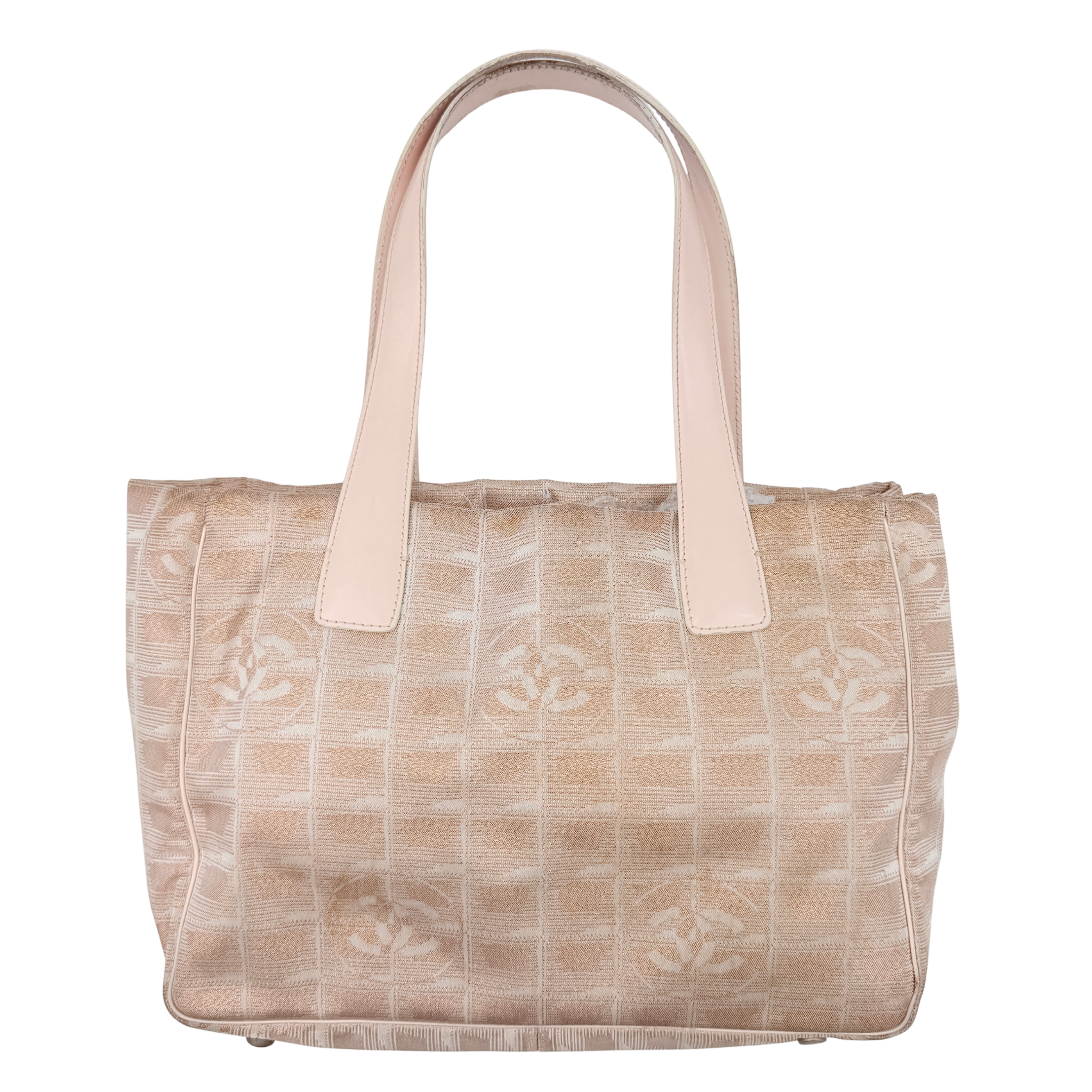 Chanel New Travel Line Tote Bag in rose gold jacquard with blush leather handles, displayed against a white background.