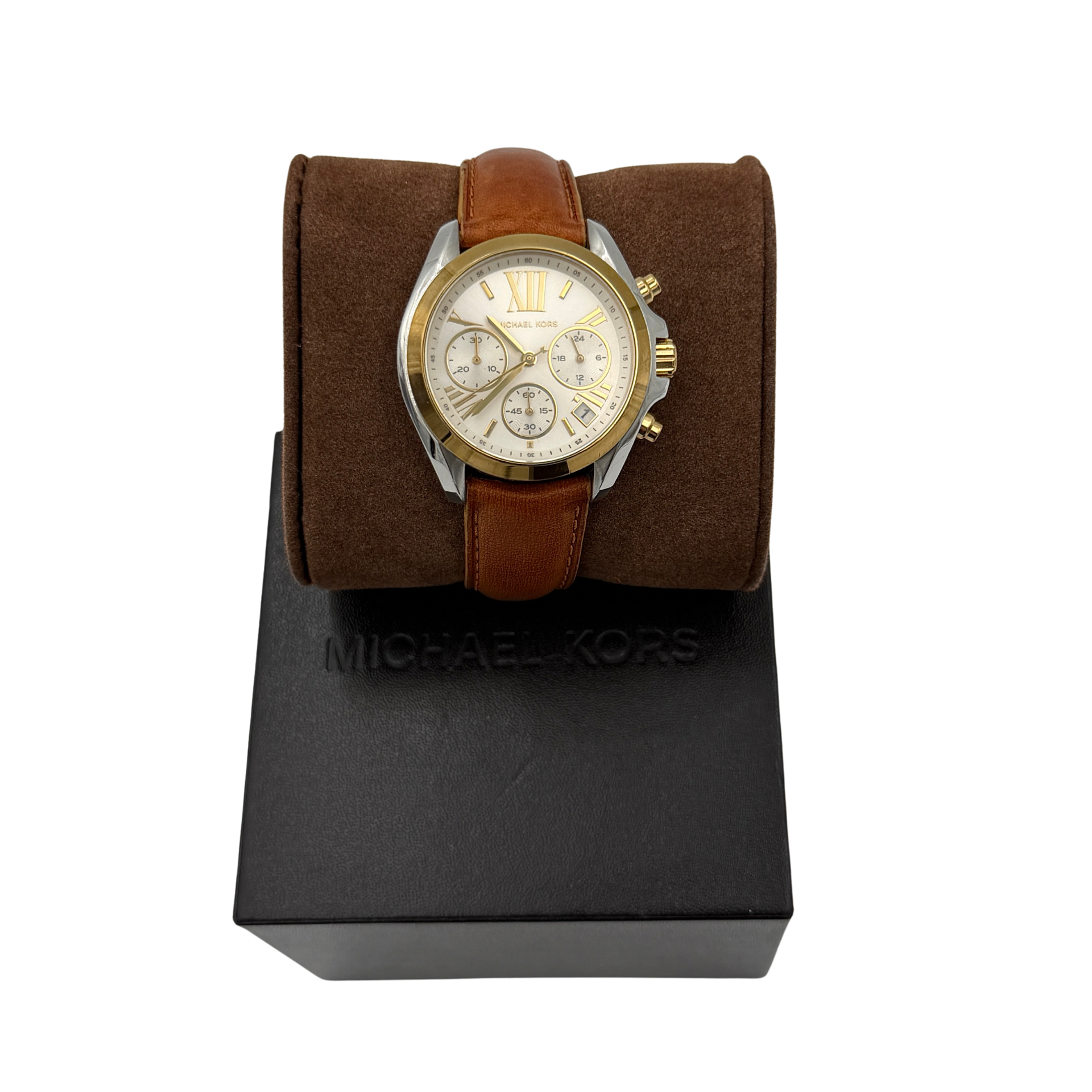 Michael Kors MK-2301 gold and silver tone chronograph watch with brown leather strap, showcased on a brown cushion atop the branded box.