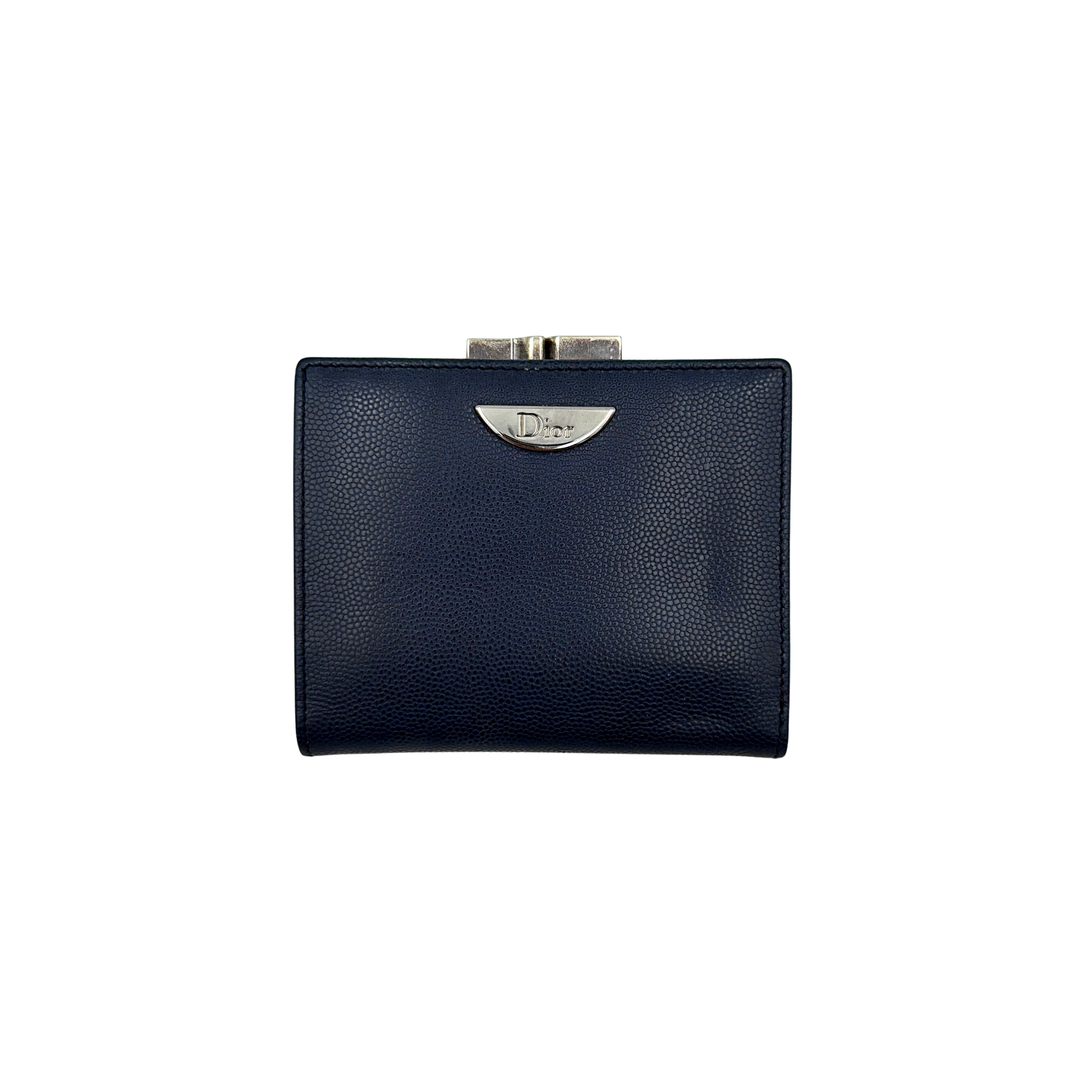 Dior compact navy blue leather wallet with silver-tone logo plaque and kiss-lock clasp, showcased against a clean background.