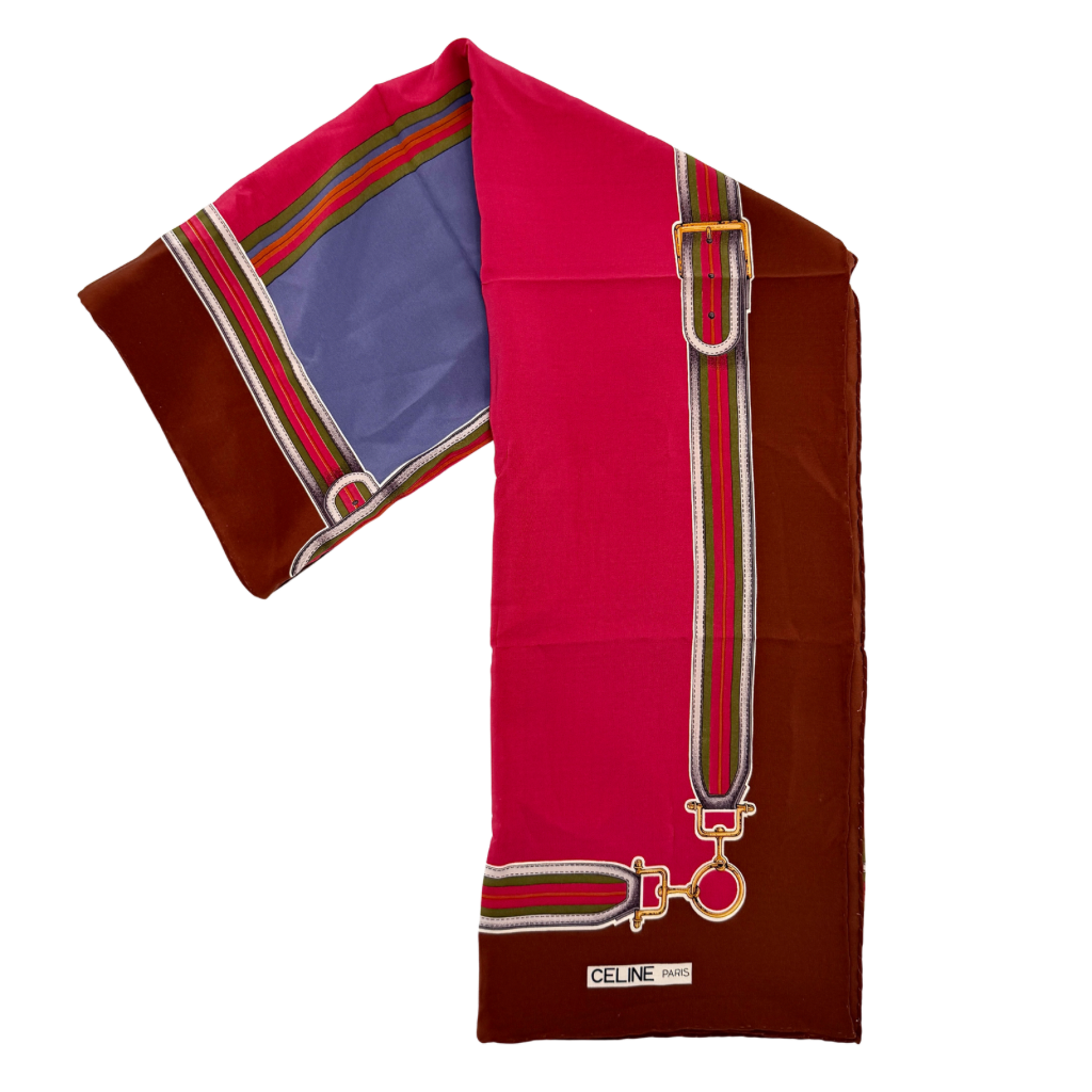 Celine silk scarf in raspberry pink, periwinkle blue, and brown with illustrated buckle and strap motifs.