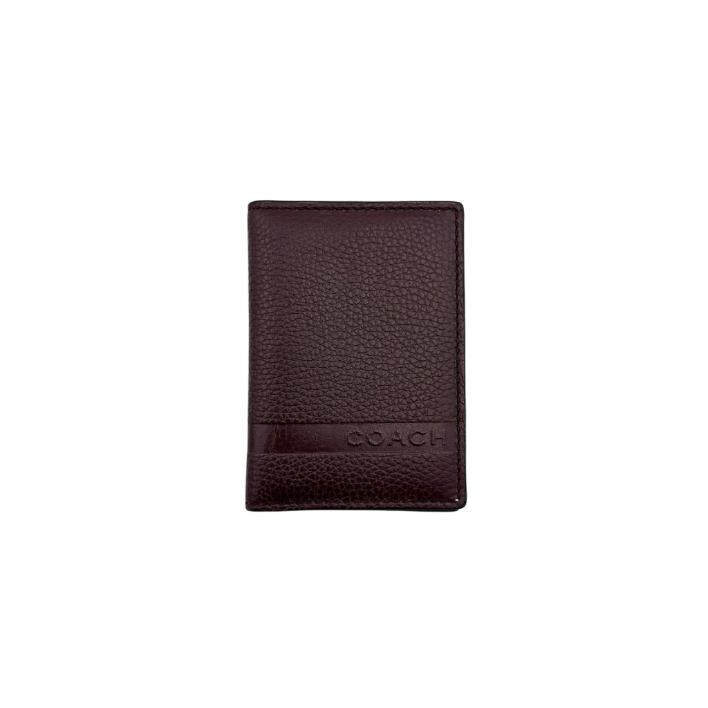 Coach Camden Slim Card Holder in burgundy pebbled leather with embossed logo and sleek bifold silhouette.