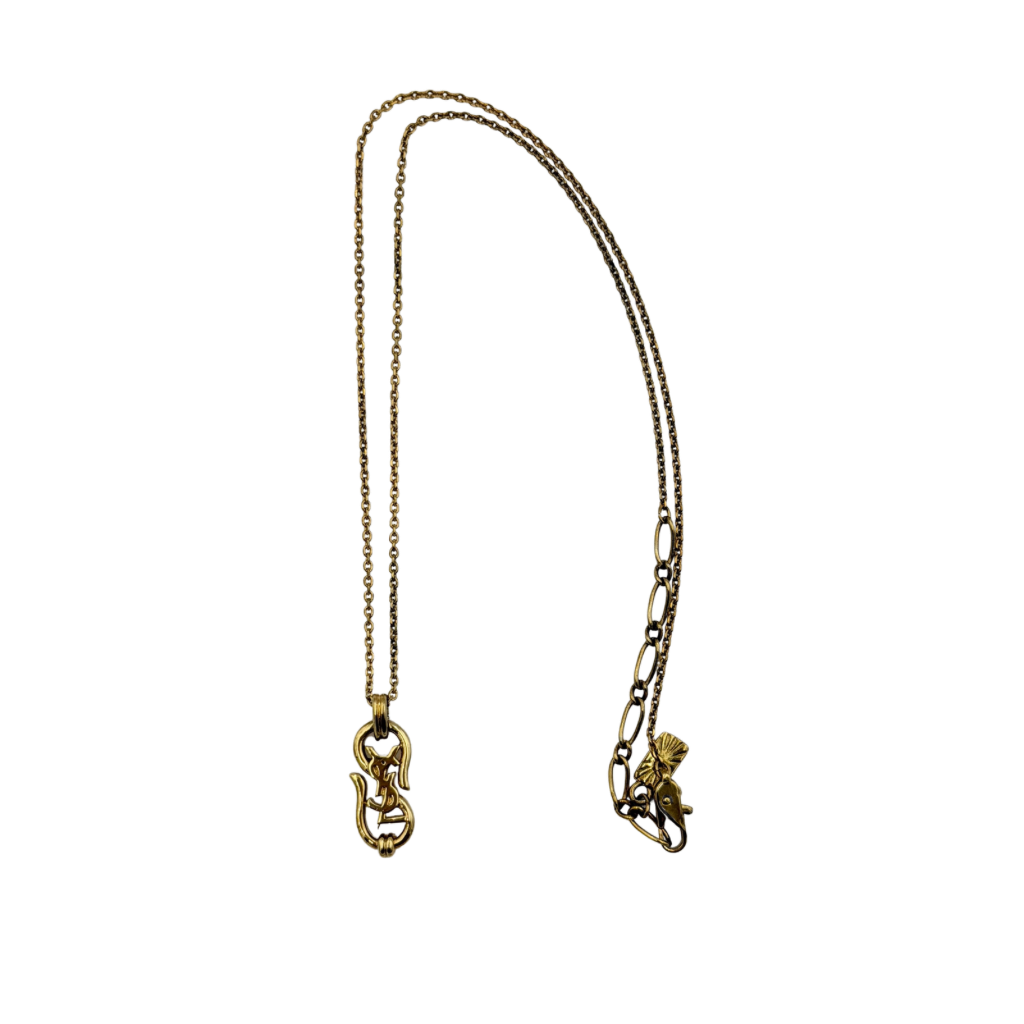 Saint Laurent Cassandre Logo Necklace in gold metal with signature YSL pendant displayed on a necklace stand.