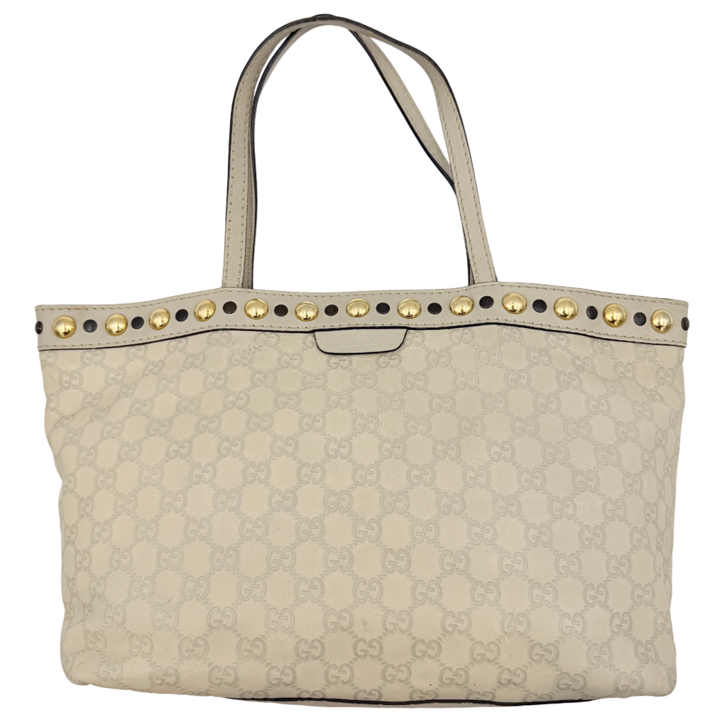 Gucci GG Monogram Babouska shoulder bag in cream canvas with gold-tone stud details and double top handles.