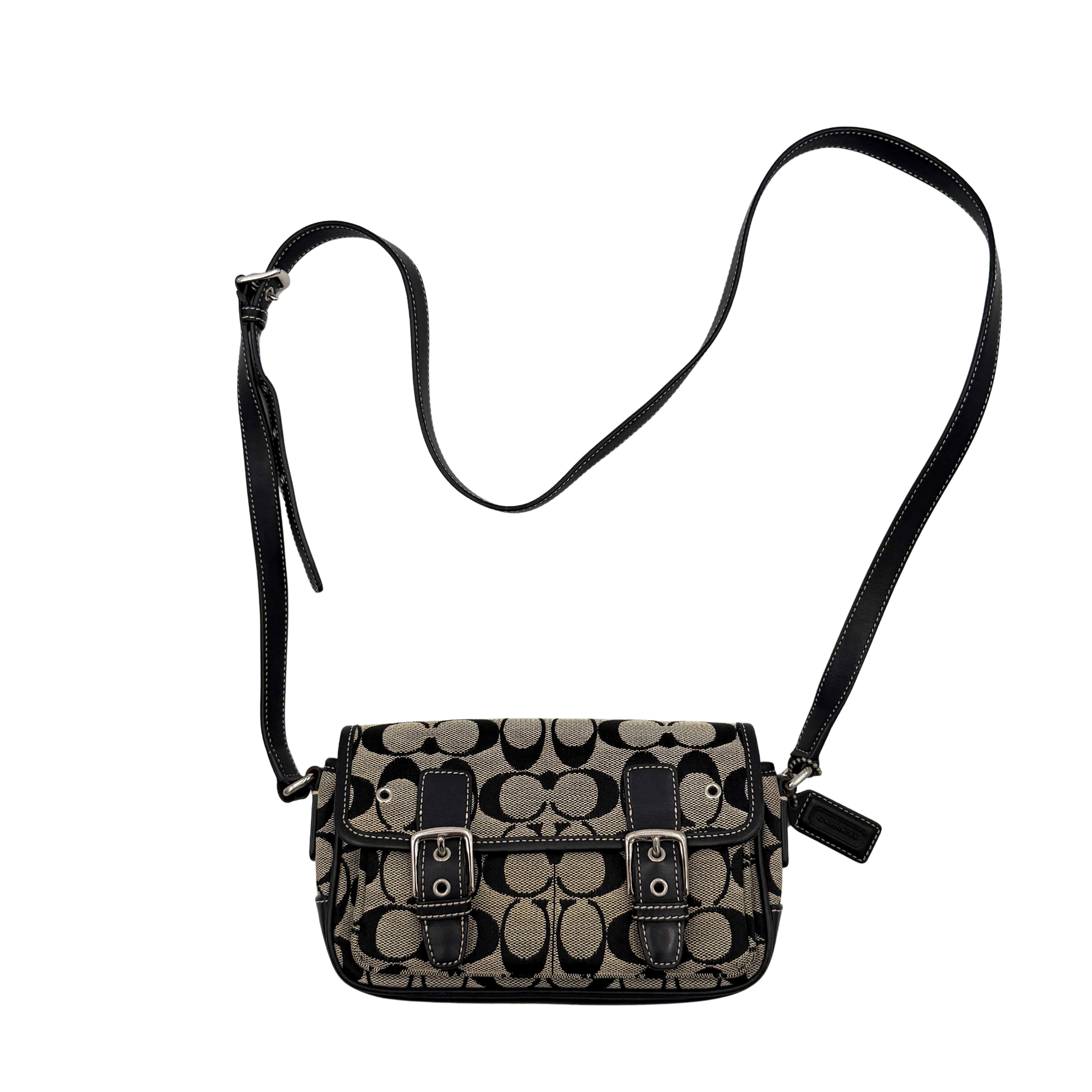 Coach Signature Double Buckle Crossbody bag in grey and black jacquard canvas, accented with black leather trim and dual silver-tone buckle detailing.