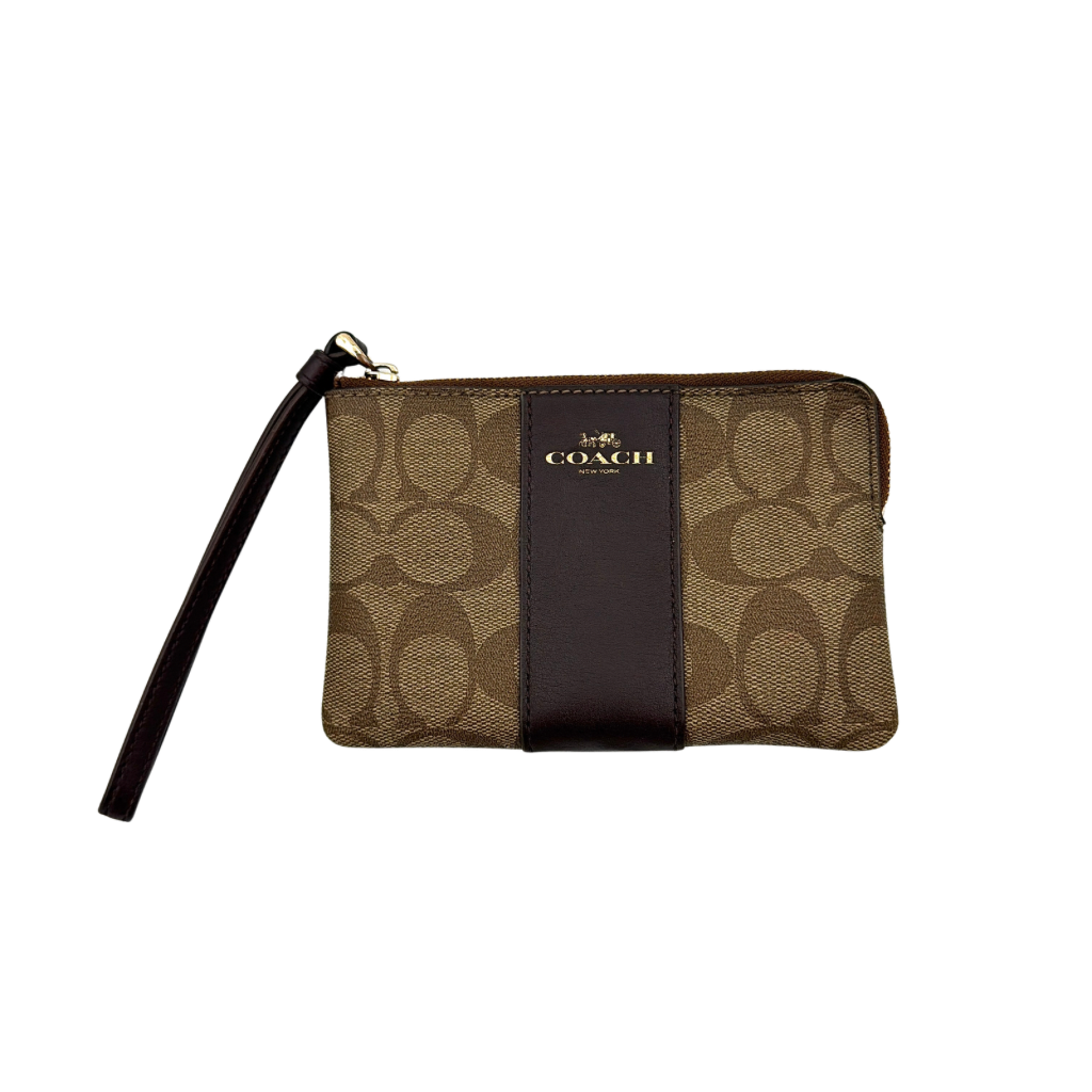Coach Signature Stripe Corner Zip Wristlet in beige and brown canvas with a dark brown leather stripe and gold logo, shown with wristlet strap.