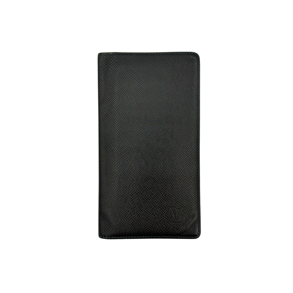 Louis Vuitton Taiga Brazza Wallet in dark green Taiga leather, showcasing a textured finish and iconic LV embossing in the bottom corner.