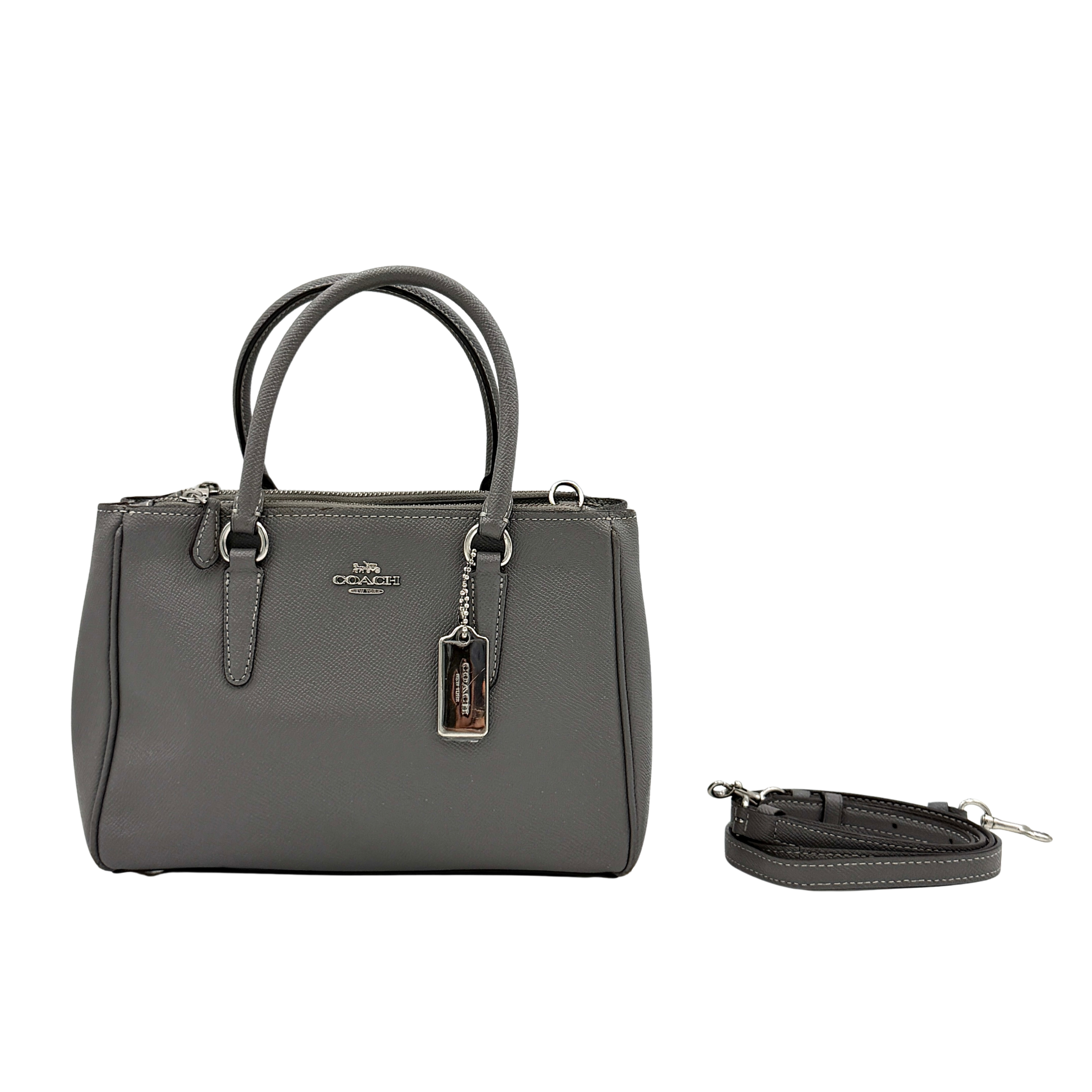 Coach 2Way Mini Surrey Carryall Handbag in grey textured leather with top handles and detachable strap, styled against a clean background.