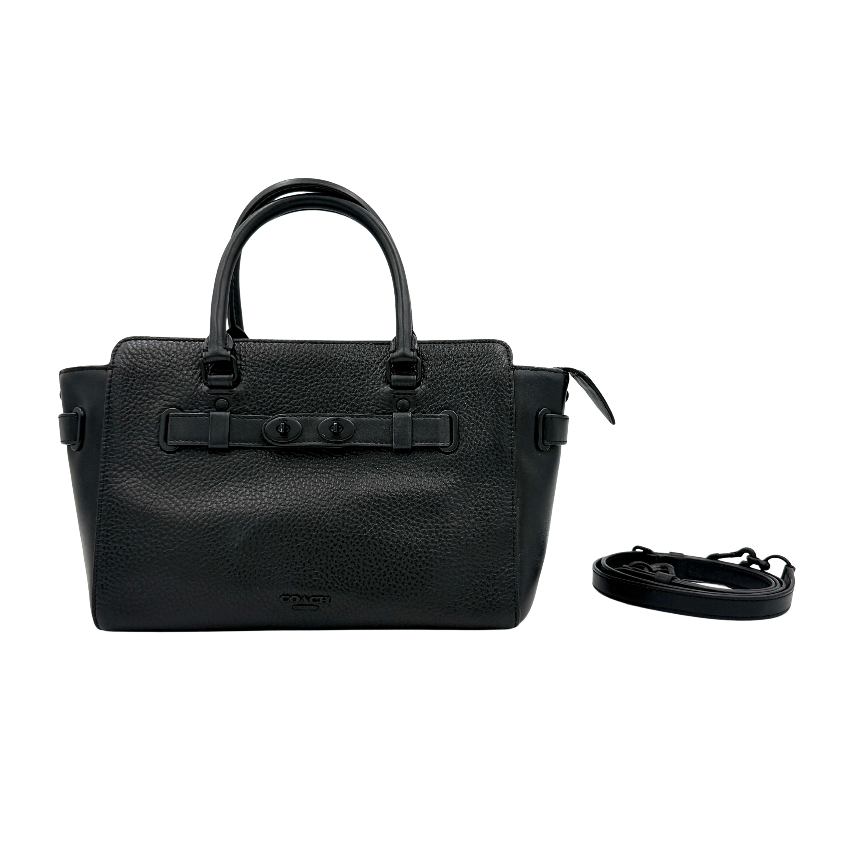 Coach Blake Carryall 25 bag in black pebbled leather with dual top handles, detachable strap, and front turnlock accents.