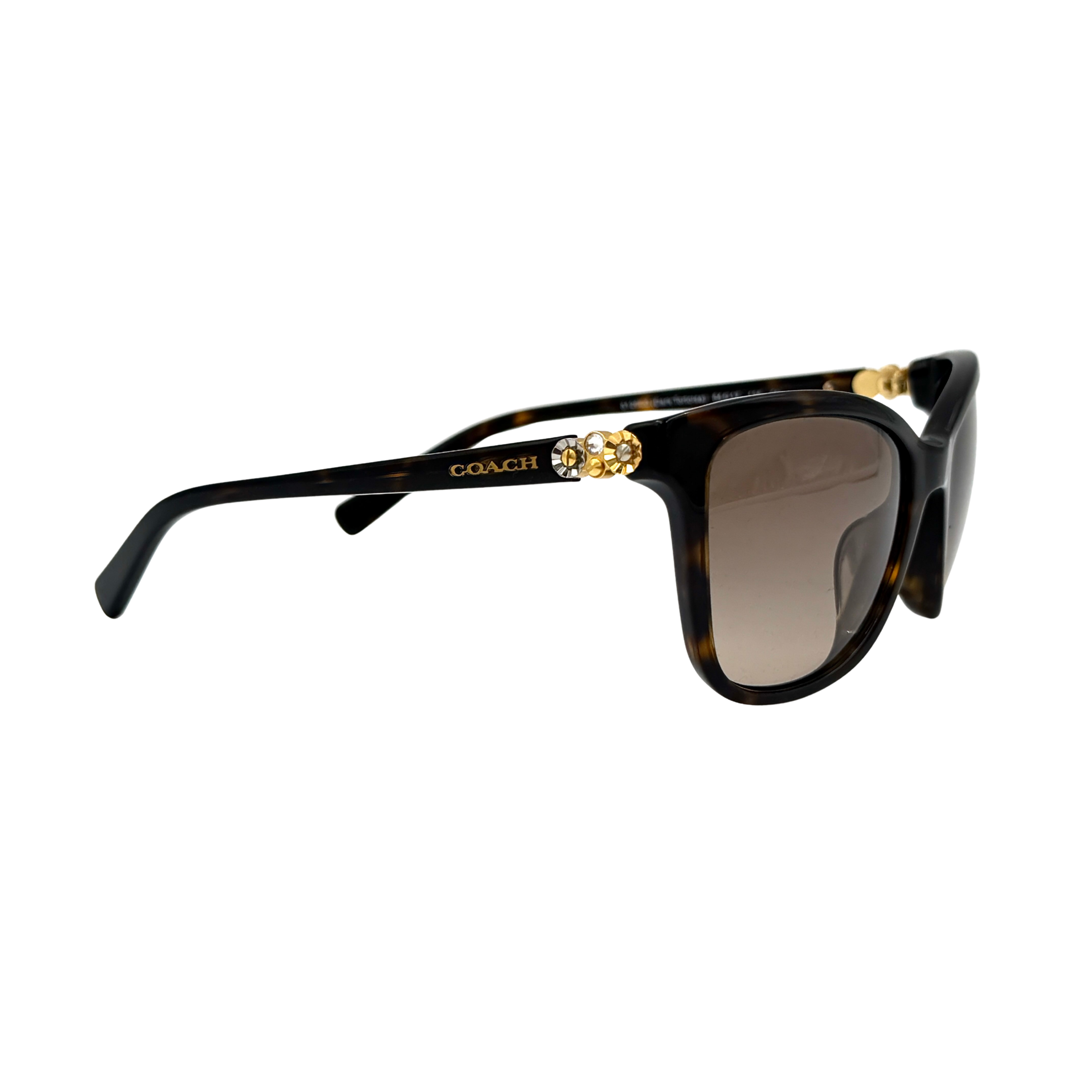 Coach HC8187BF sunglasses in dark tortoise acetate with gold floral and crystal temple detailing, shown in a three-quarter profile.