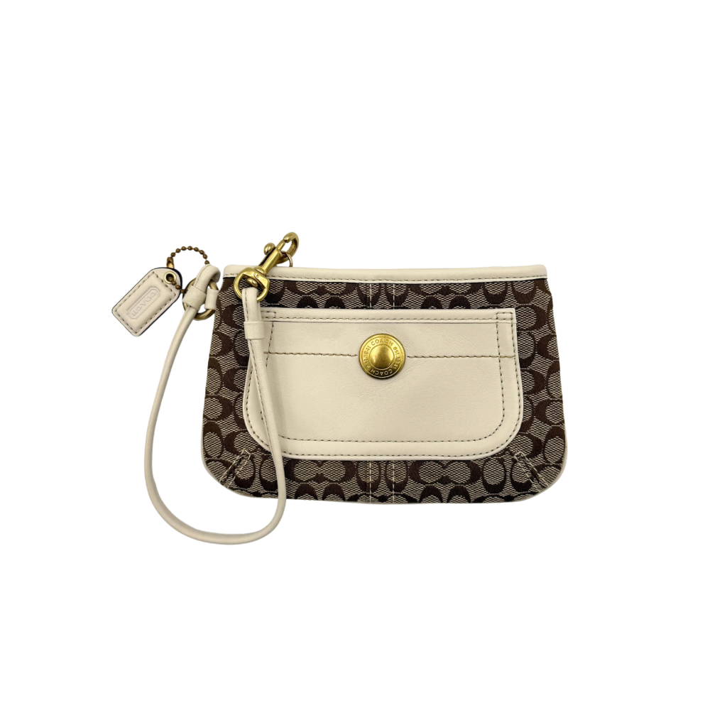 Coach Signature Canvas Wristlet in brown and ivory leather with gold-tone hardware and detachable wrist strap.