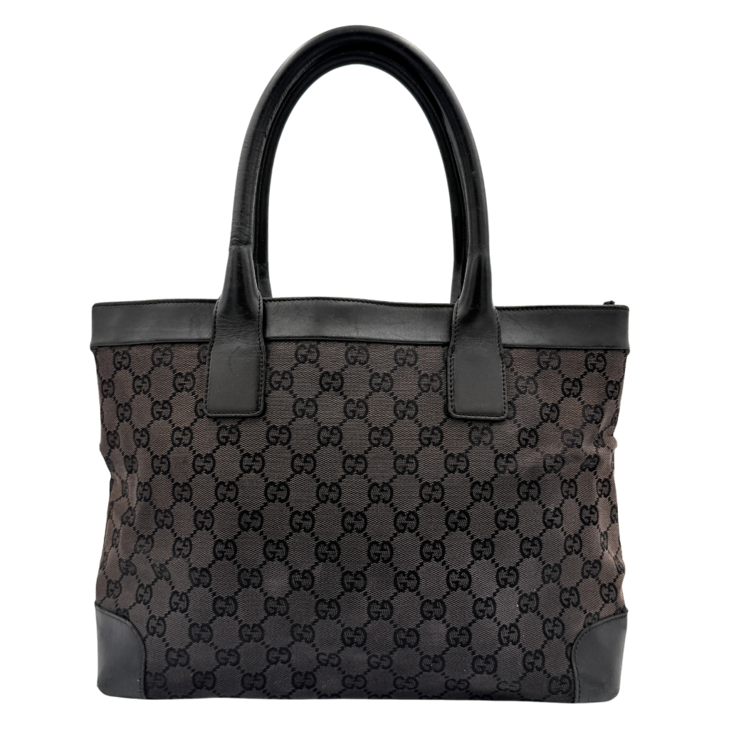 Gucci GG Monogram Leather Tote Bag in black canvas and leather, with structured top handles and allover GG motif.