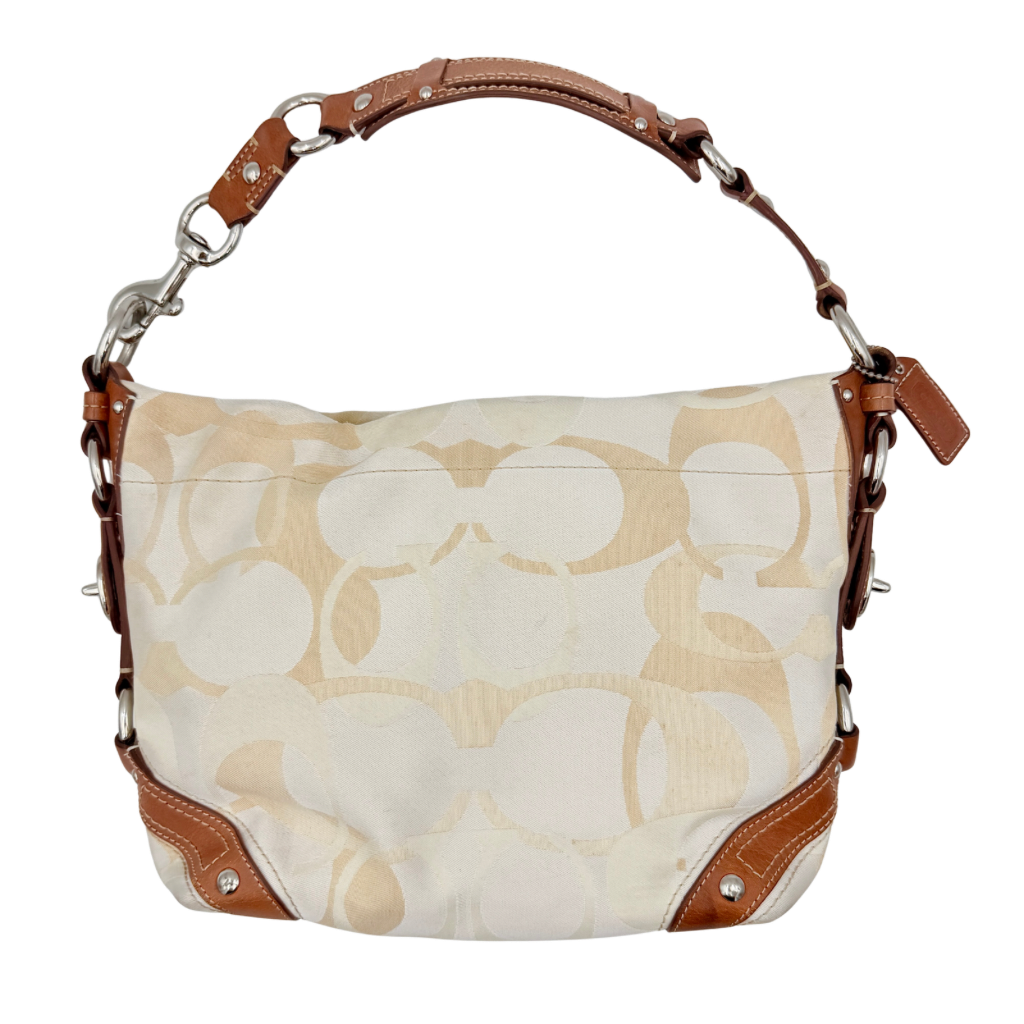Coach Signature Carly Hobo shoulder bag in cream and brown canvas with tan leather trim and chain-detailed strap.