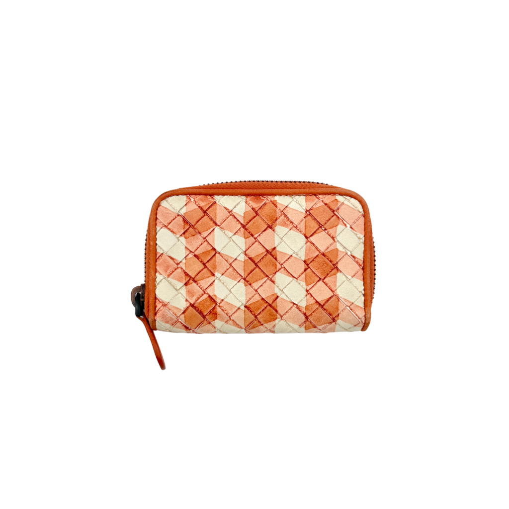 Front view of the Bottega Veneta Intrecciato zip around wallet in orange and white woven leather.