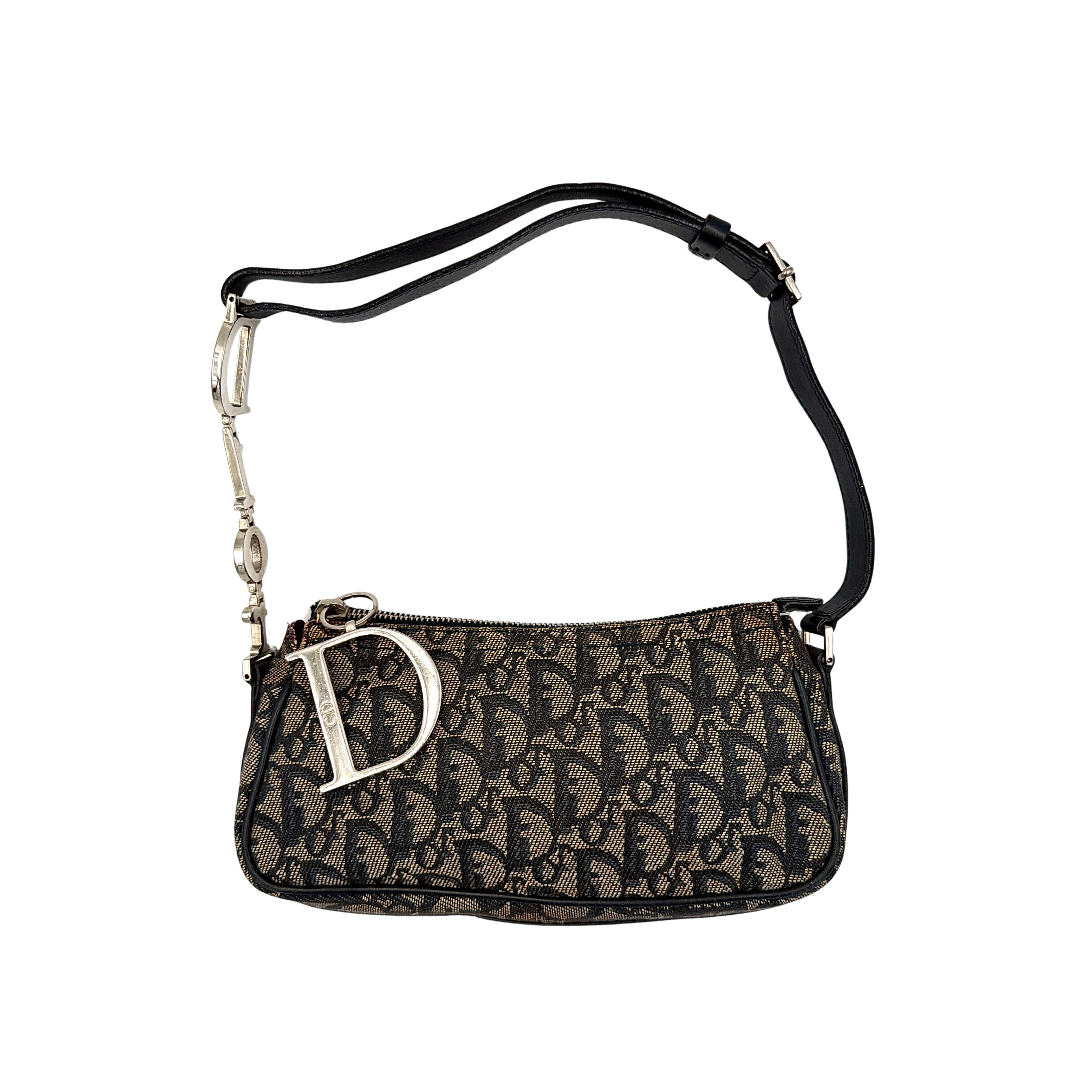 Dior Trotter Charm Pochette bag in grey and navy oblique canvas, featuring bold silver-tone Dior letter charms and a black leather strap.