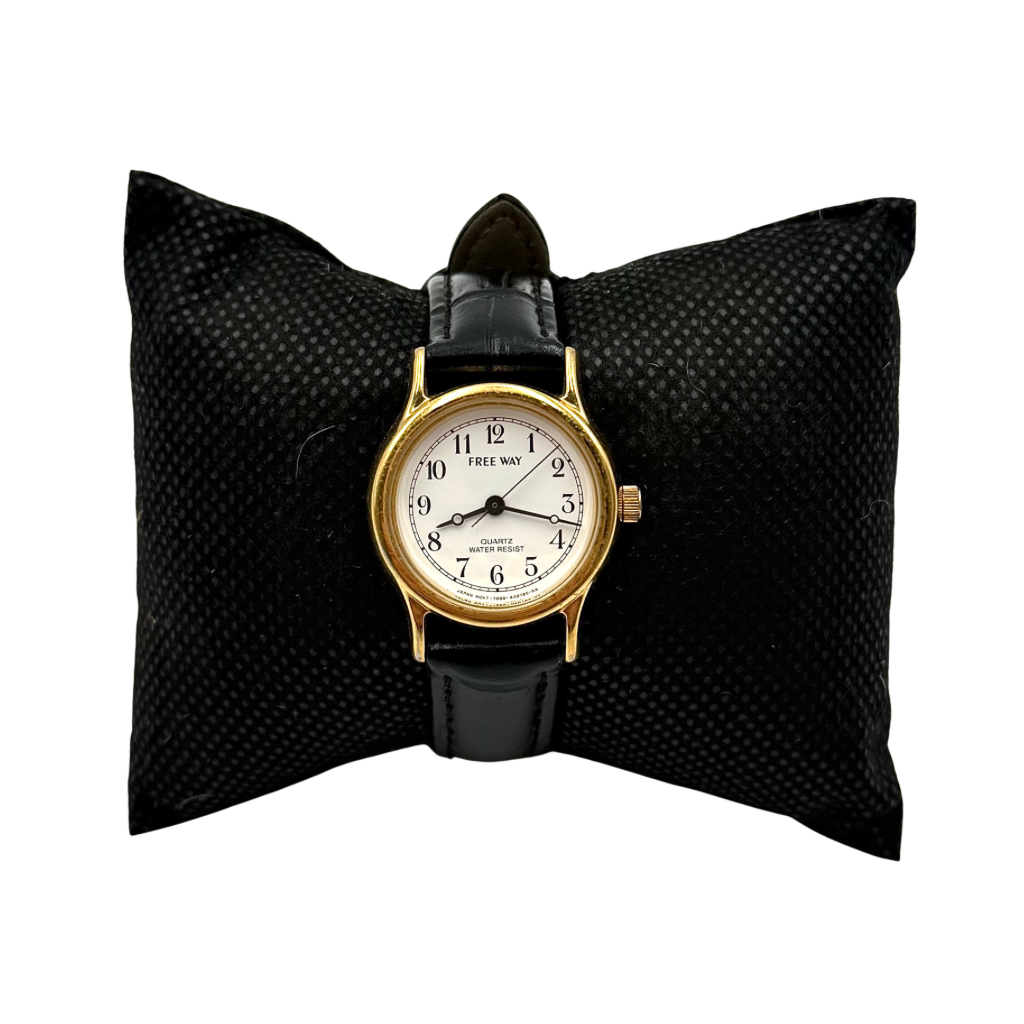 Citizen Freeway Quartz watch with white dial, gold case, and black leather strap displayed on a black cushion.