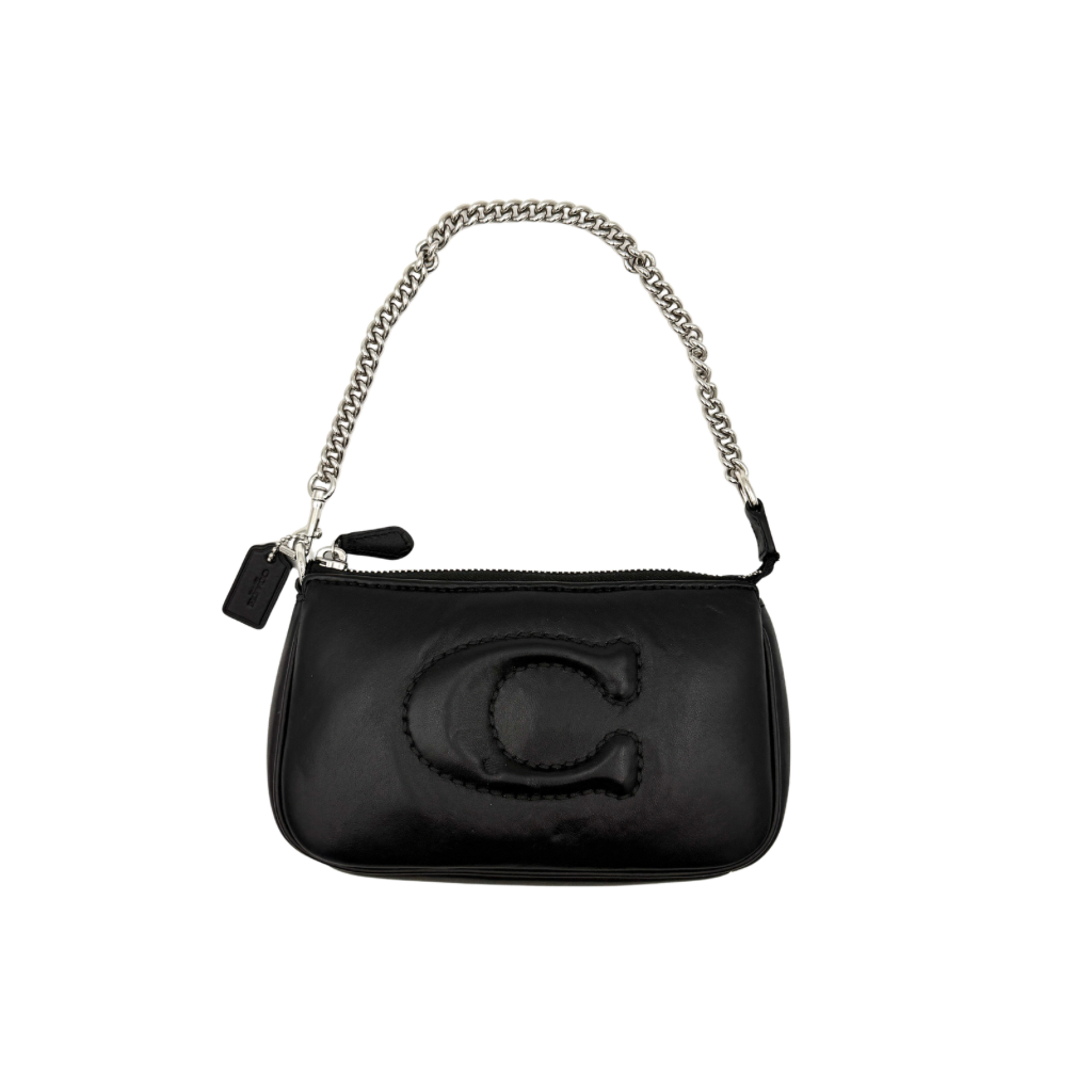 Coach Nolita 19 shoulder bag in quilted black leather with a bold stitched 'C' emblem and chunky silver chain strap.
