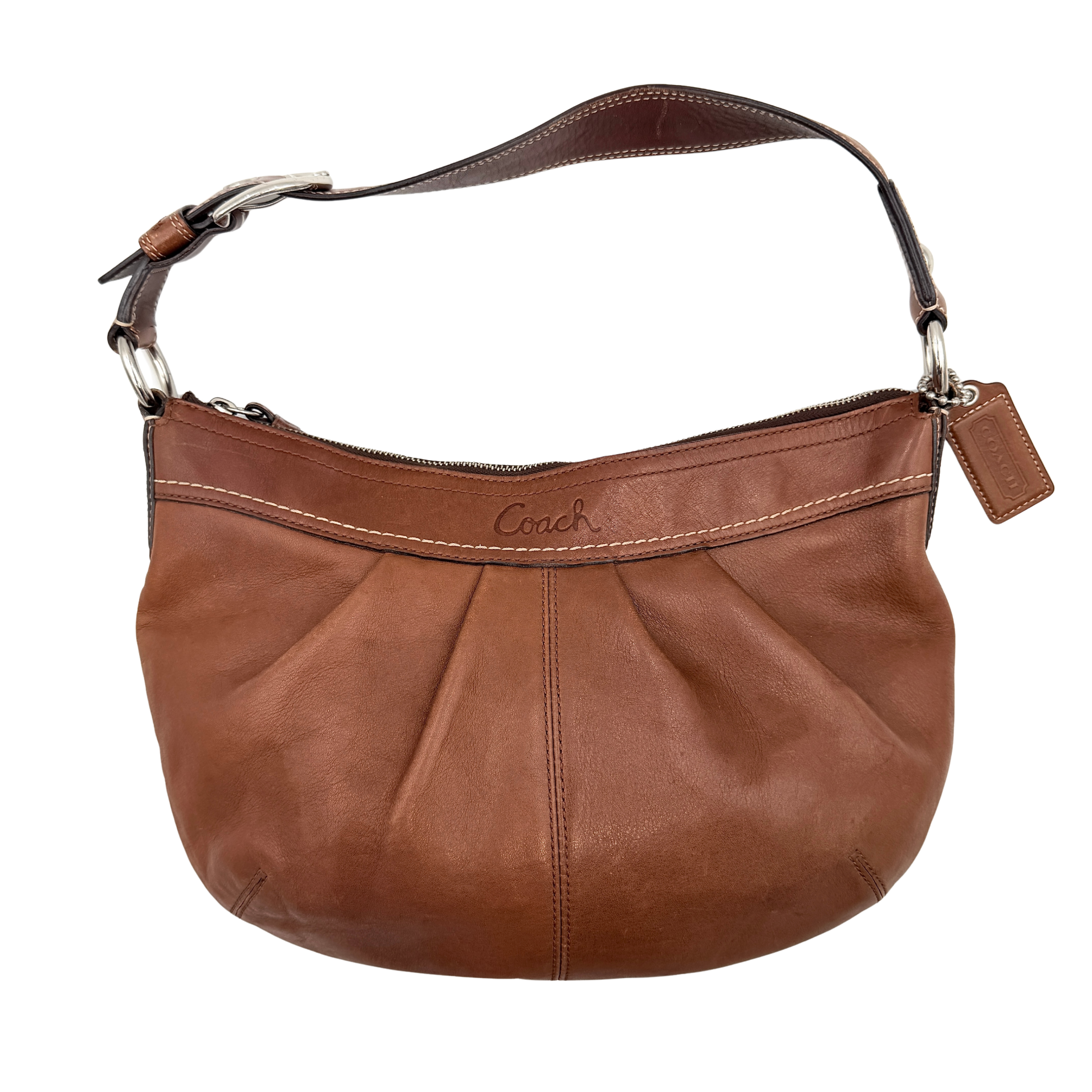 Coach Soho Hobo brown leather shoulder bag with pleated detailing and silver hardware, shown on a white background.