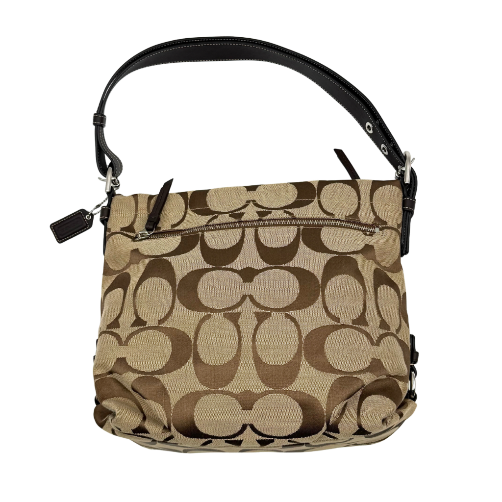 Coach beige and brown signature canvas hobo shoulder bag with black leather strap and silver hardware shown on a white background.