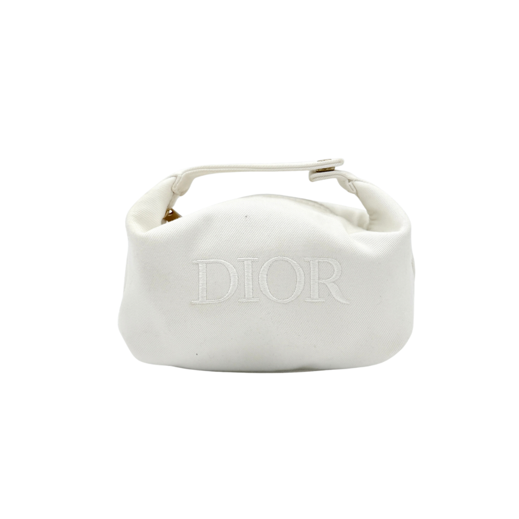 A structured white Dior pouch in twill with tonal logo embroidery and gold-tone zip, displayed against a pristine backdrop.