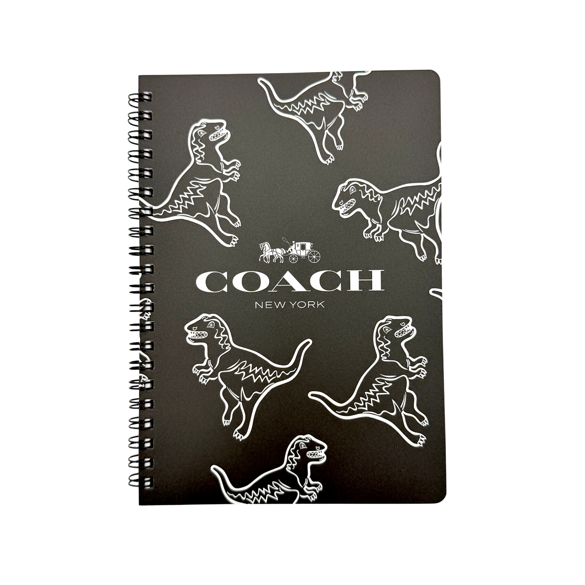 Coach Rexy Journal Notebook in black featuring white Rexy dinosaur illustrations and a spiral binding.