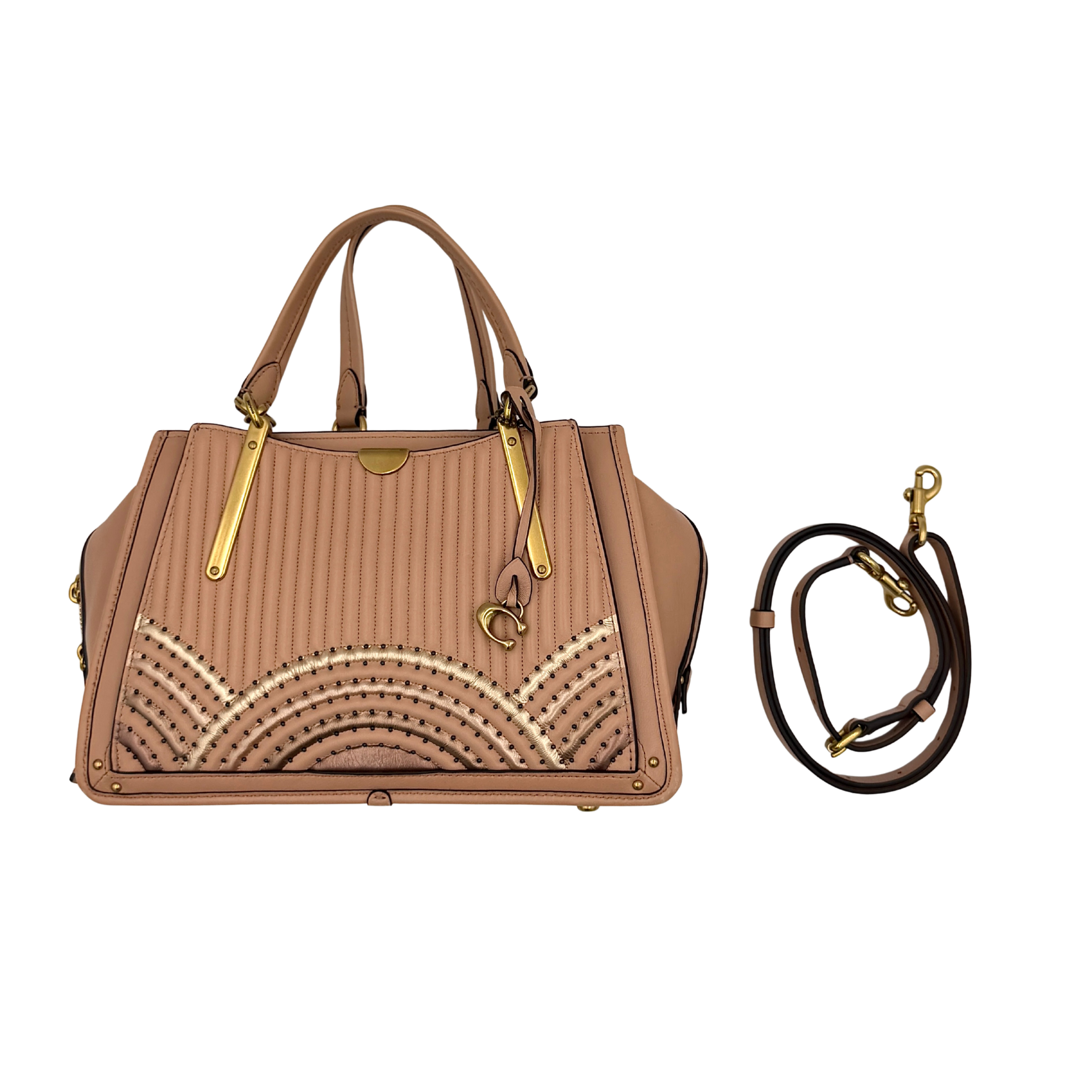 Coach Dreamer 27 handbag in nude pink leather with Deco quilting, gold rivets, and detachable strap, displayed elegantly on a plain background.